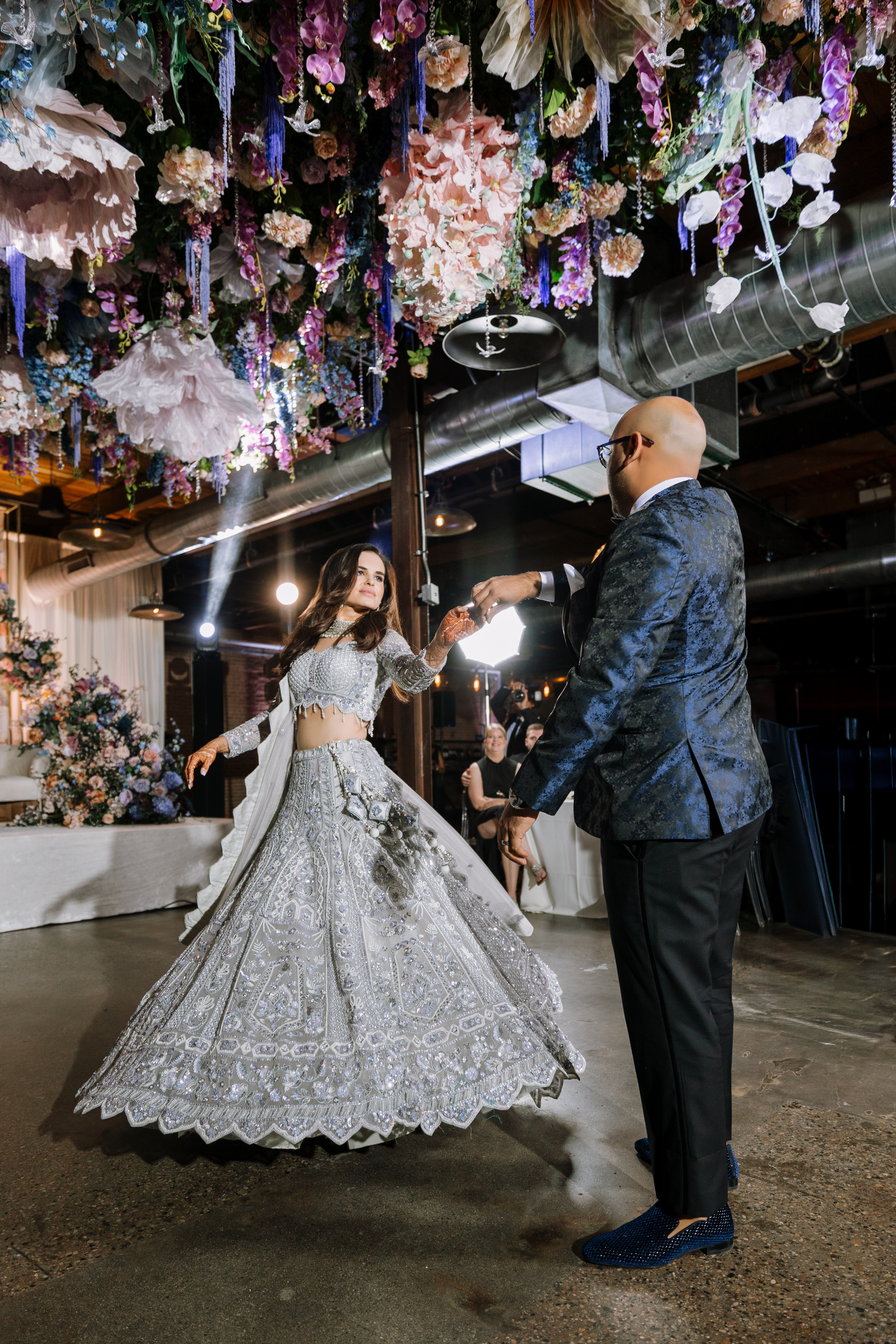bride and groom dancing under the floral filled ceiling-Lusia Studio Photography