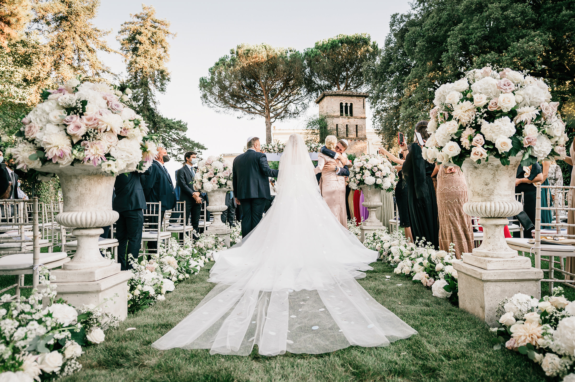 back-view-of-bride-father-processional-with-abundant-floral-decor-photo-by-emiliano-russo-photography