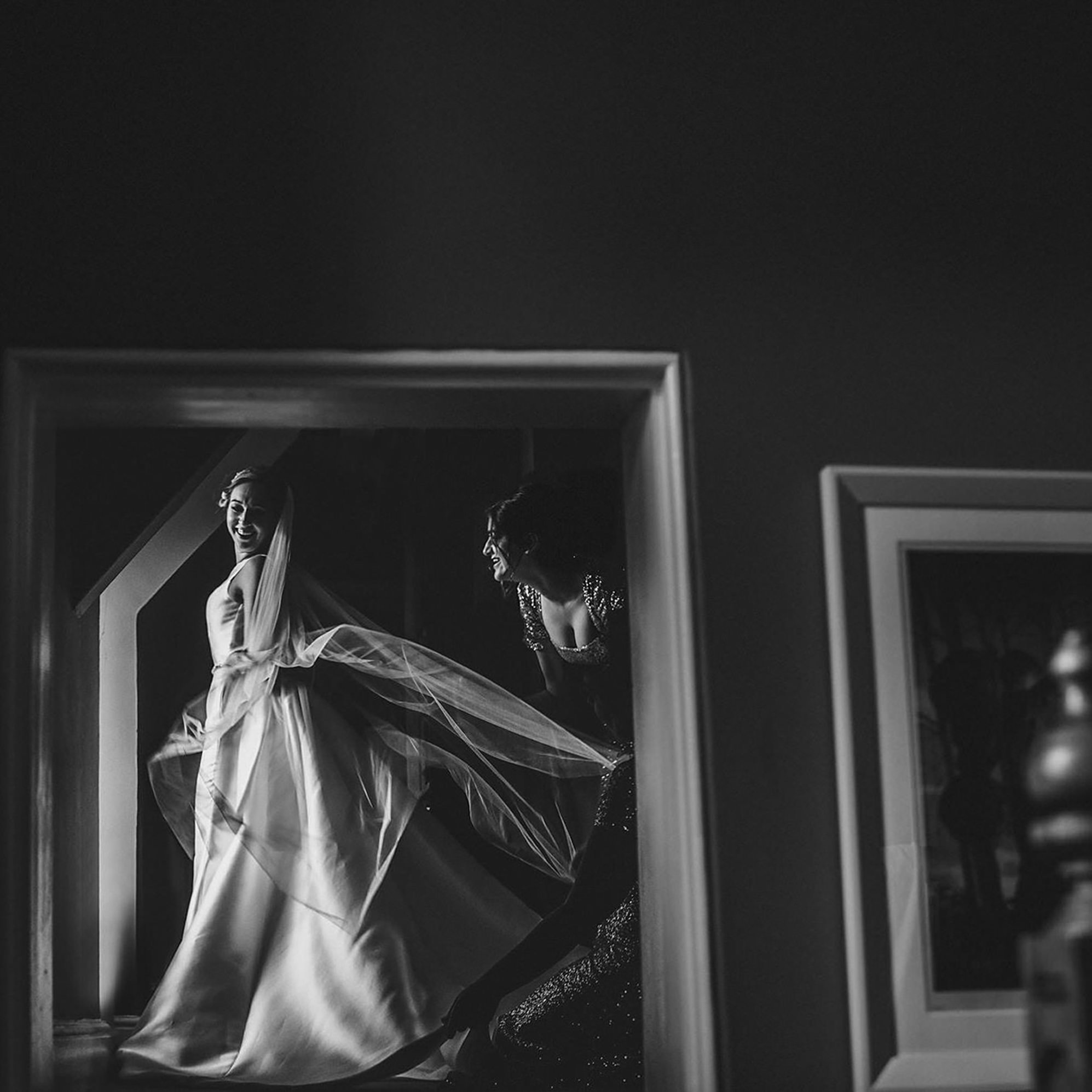 bride-seeing-herself-in-wedding-dress-by-miki-studios