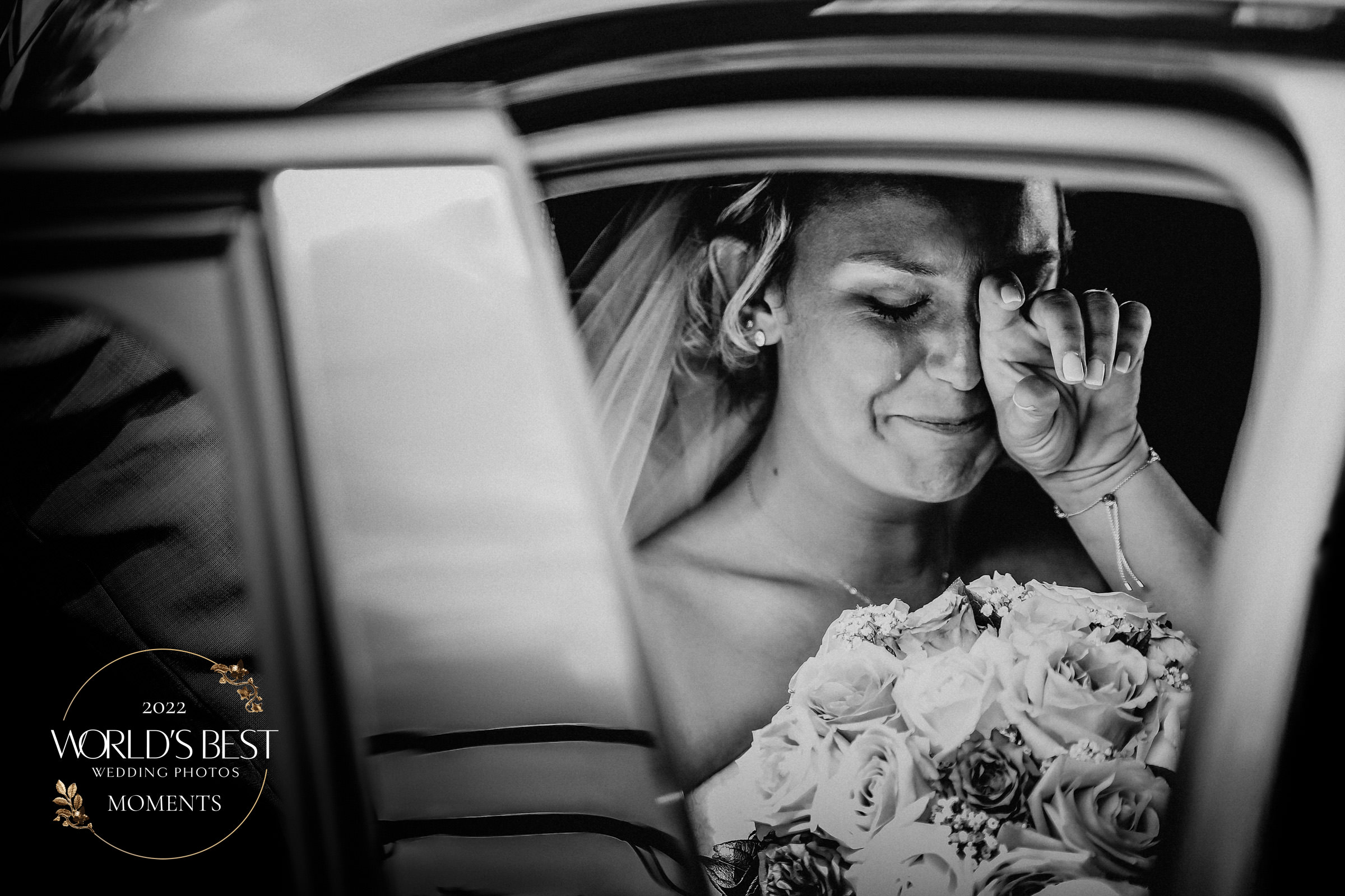 Bride wipes away tears best wedding photo by Julien Laurent-Georges Photocamex