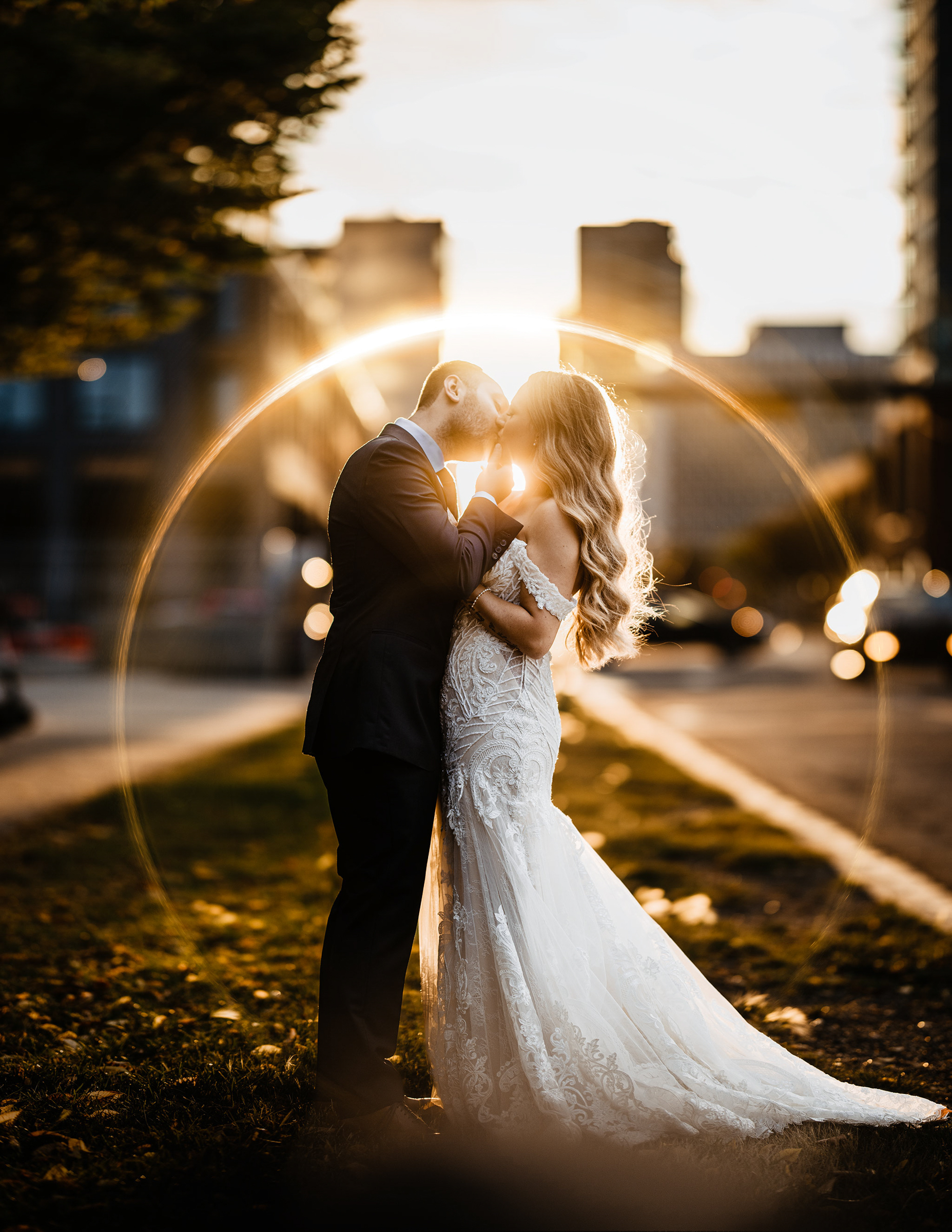 lens flare ring around kissing couple, photographed by TKshotz Photography