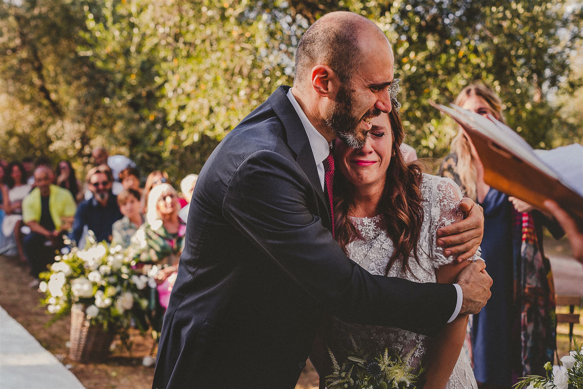 emotional-couple-hug-at-ceremony-best-wedding-photographer-italy-livio-lacurre-photography