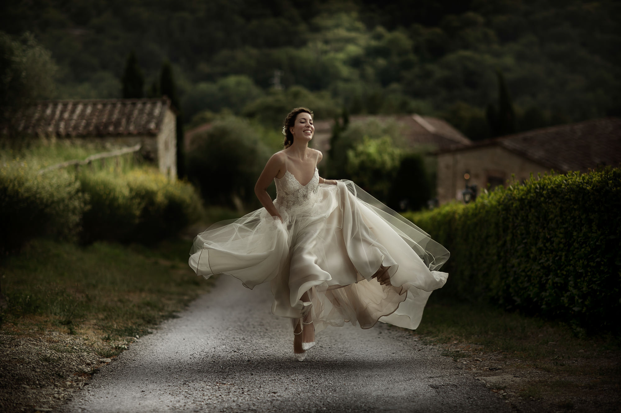 ethereal-elegant-portrait-bride-running-on-garden-path-worlds-best-wedding-photos-david-bastianoni-italy-wedding-photographers