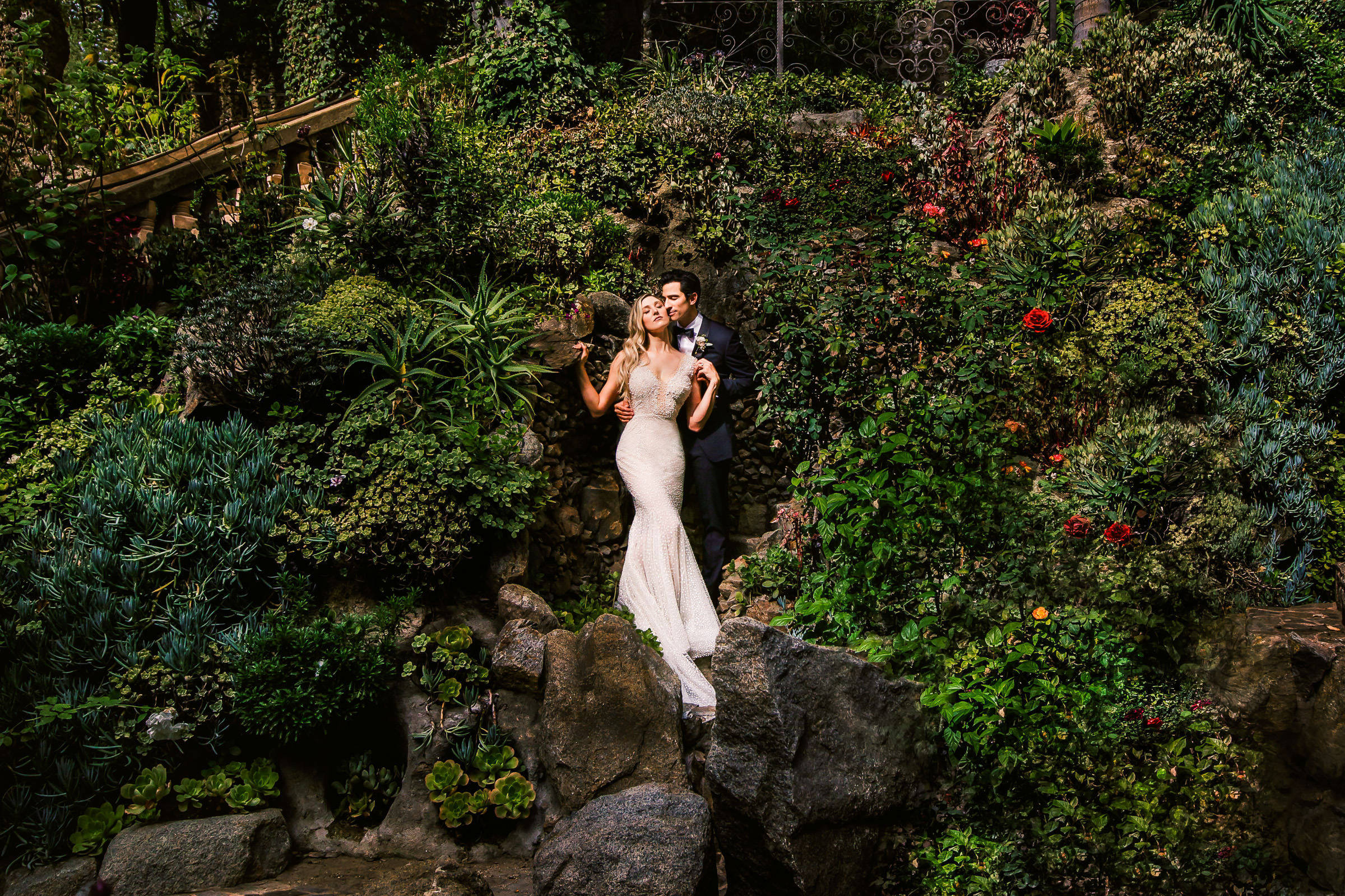 Portrait of couple at Houdini Mansion hedges by Marlies Hartmann of Los Angeles