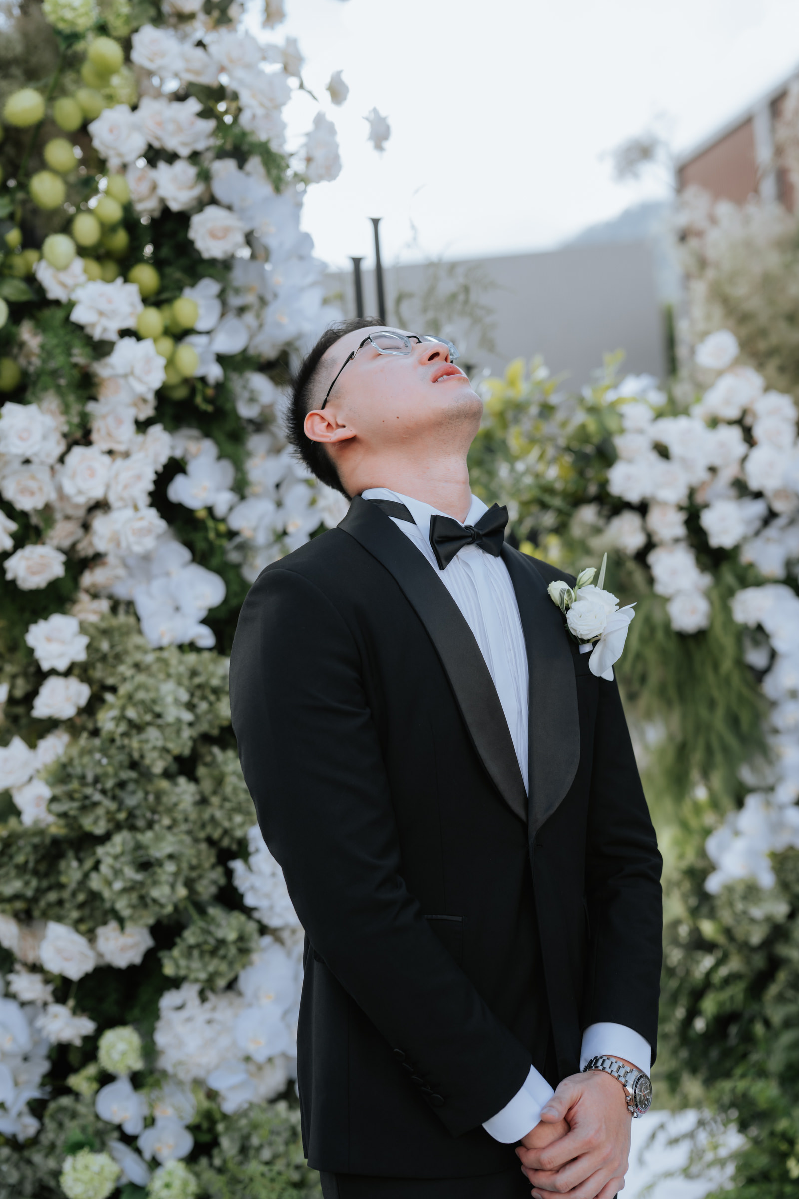 Groom trying not to cry during wedding at Acres Resort photographed by Zach Chin