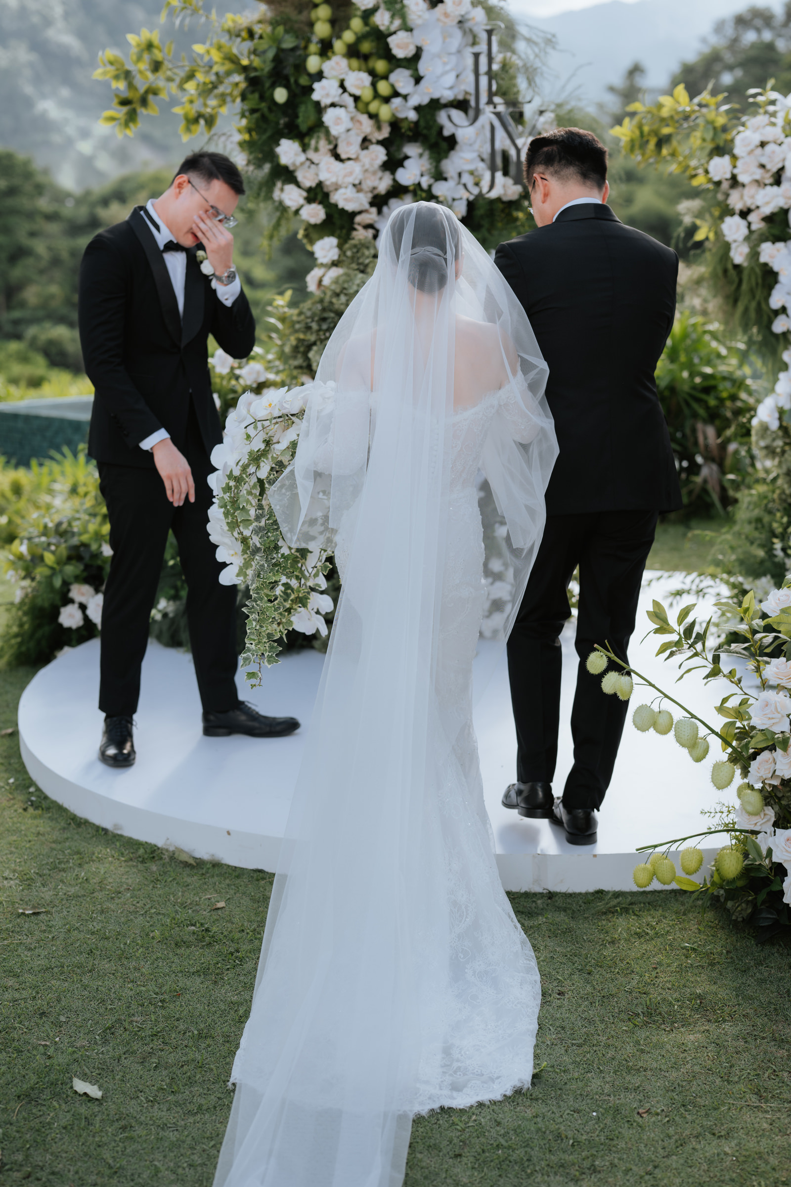 Father presents bride to groom during wedding at Acres Resort photographed by Zach Chin