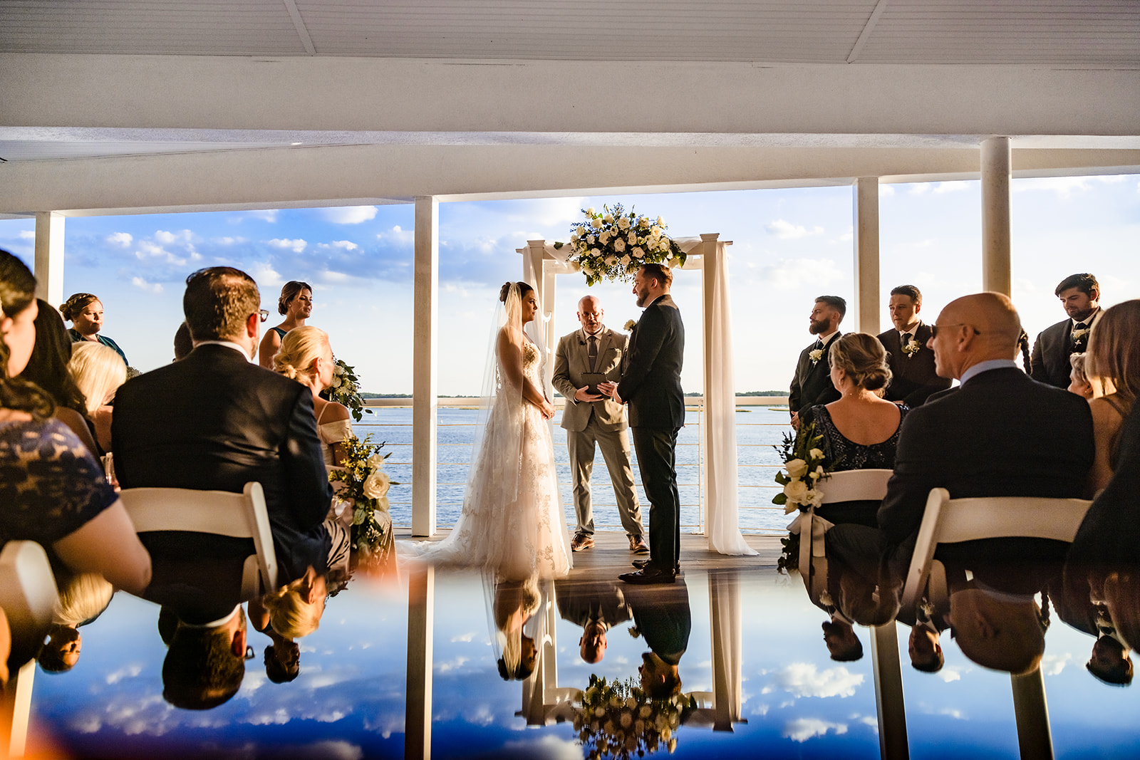 daylight-ceremony-under-arbor-with-reflection-wes-shinn-photography-and-film