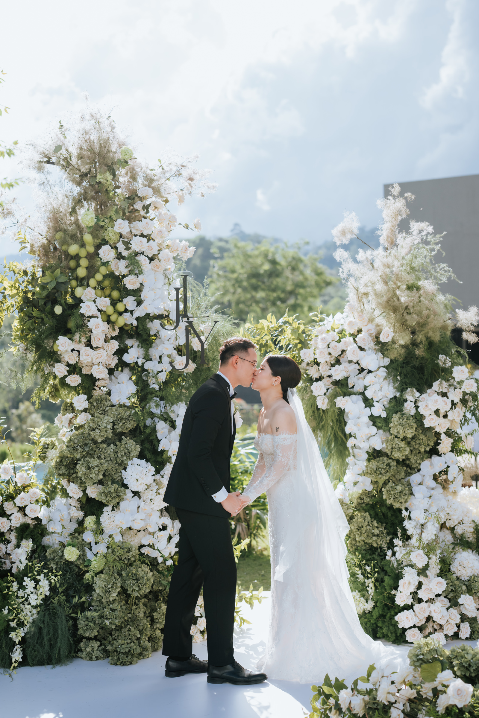 Kiss during ceremony, wedding at Acres Resort photographed by Zach Chin