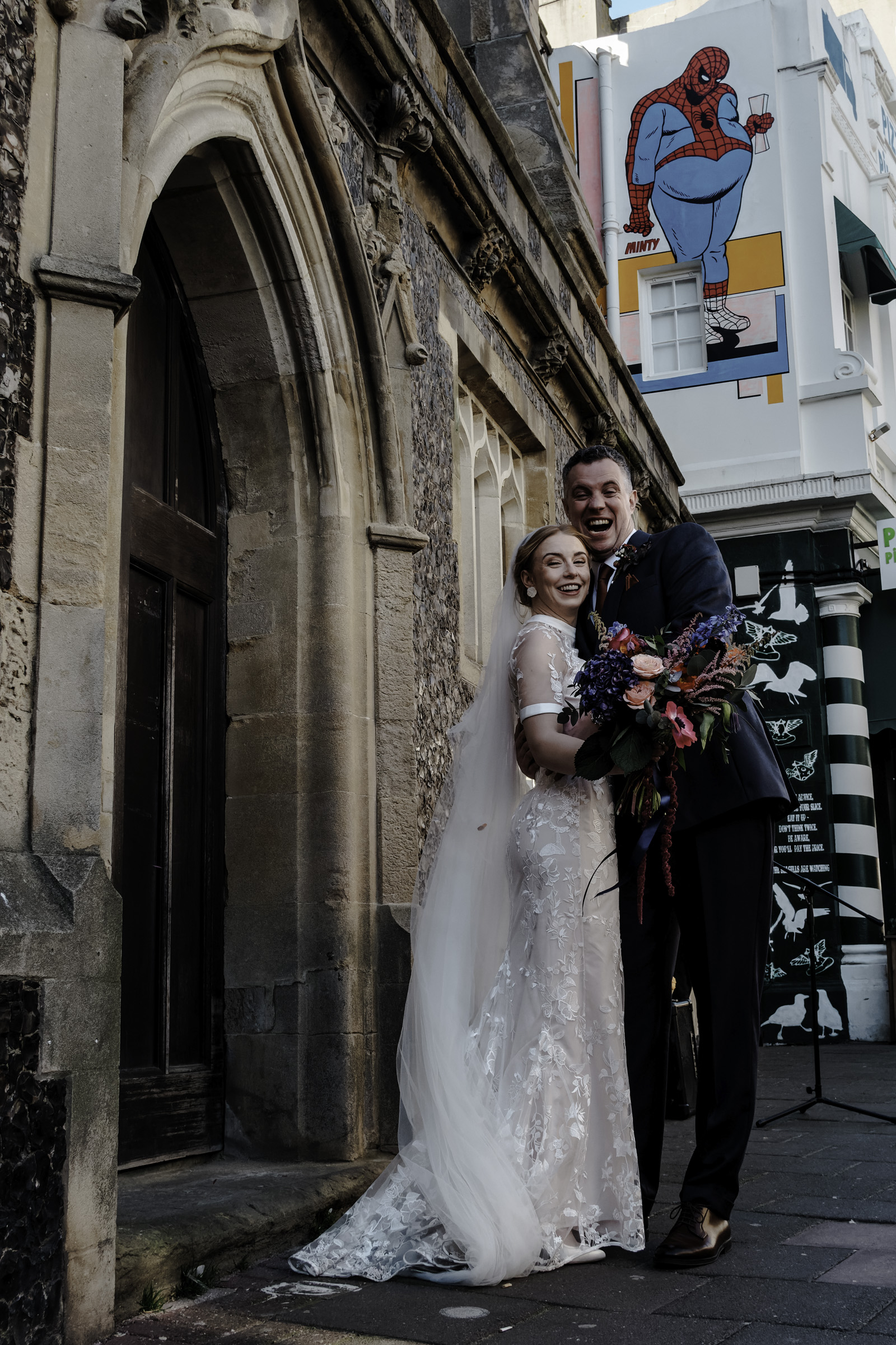 Joyful just married couple portrait Brighton Town Hall wedding Oliver Holder