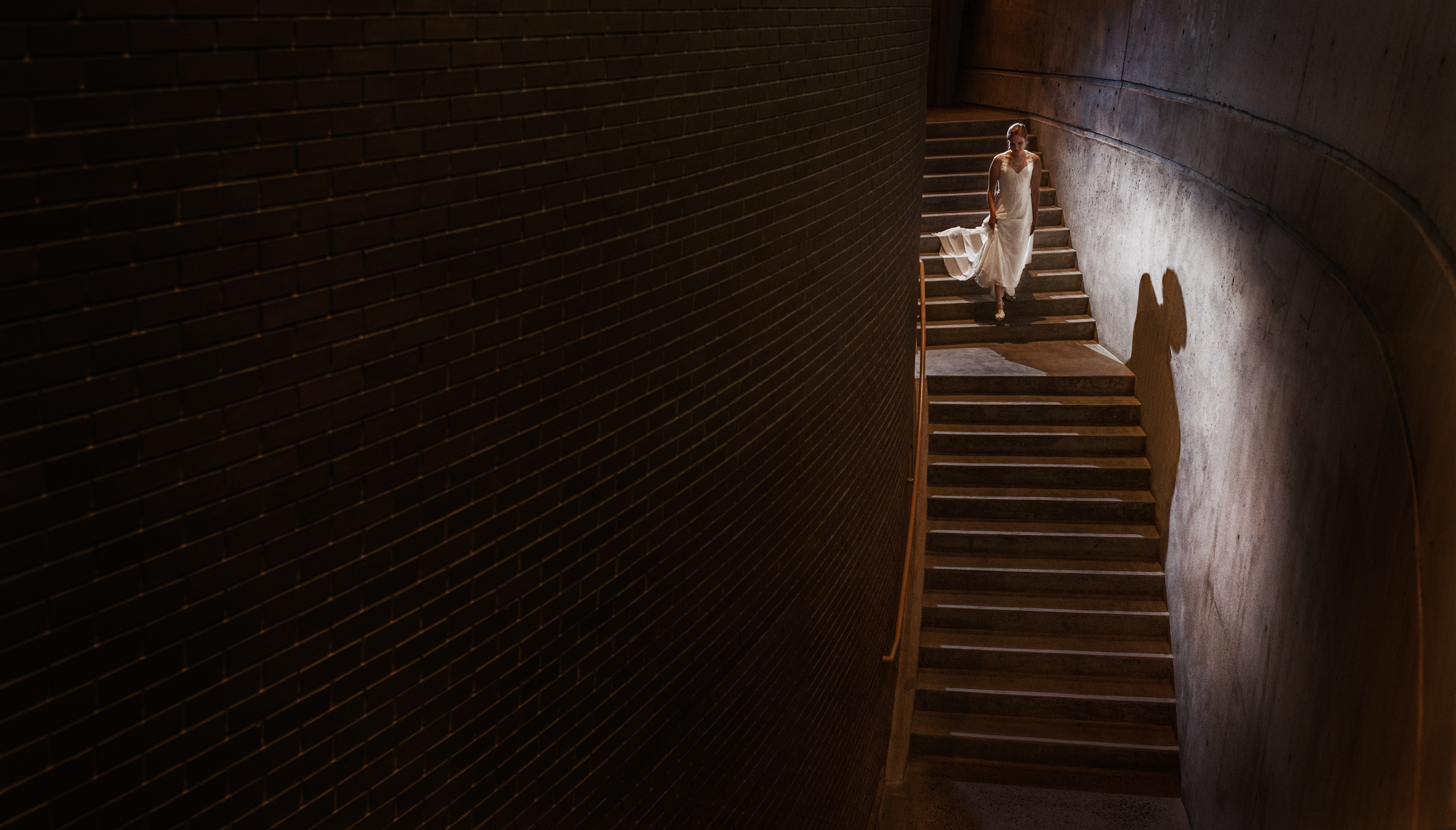 Bride descending staircase Steve and Jane