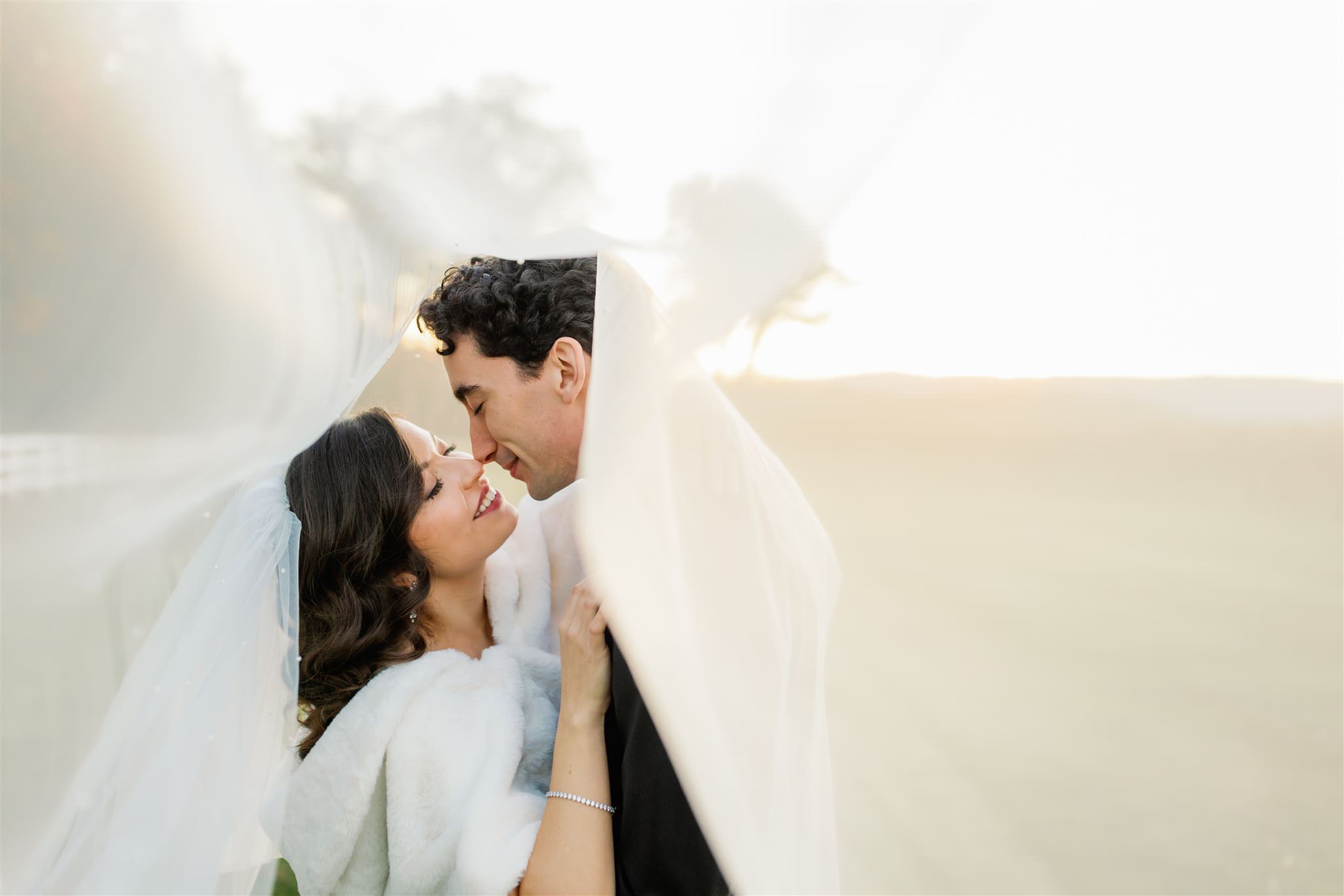 Couple moment inside brides veil Xiaoqi Li Photography