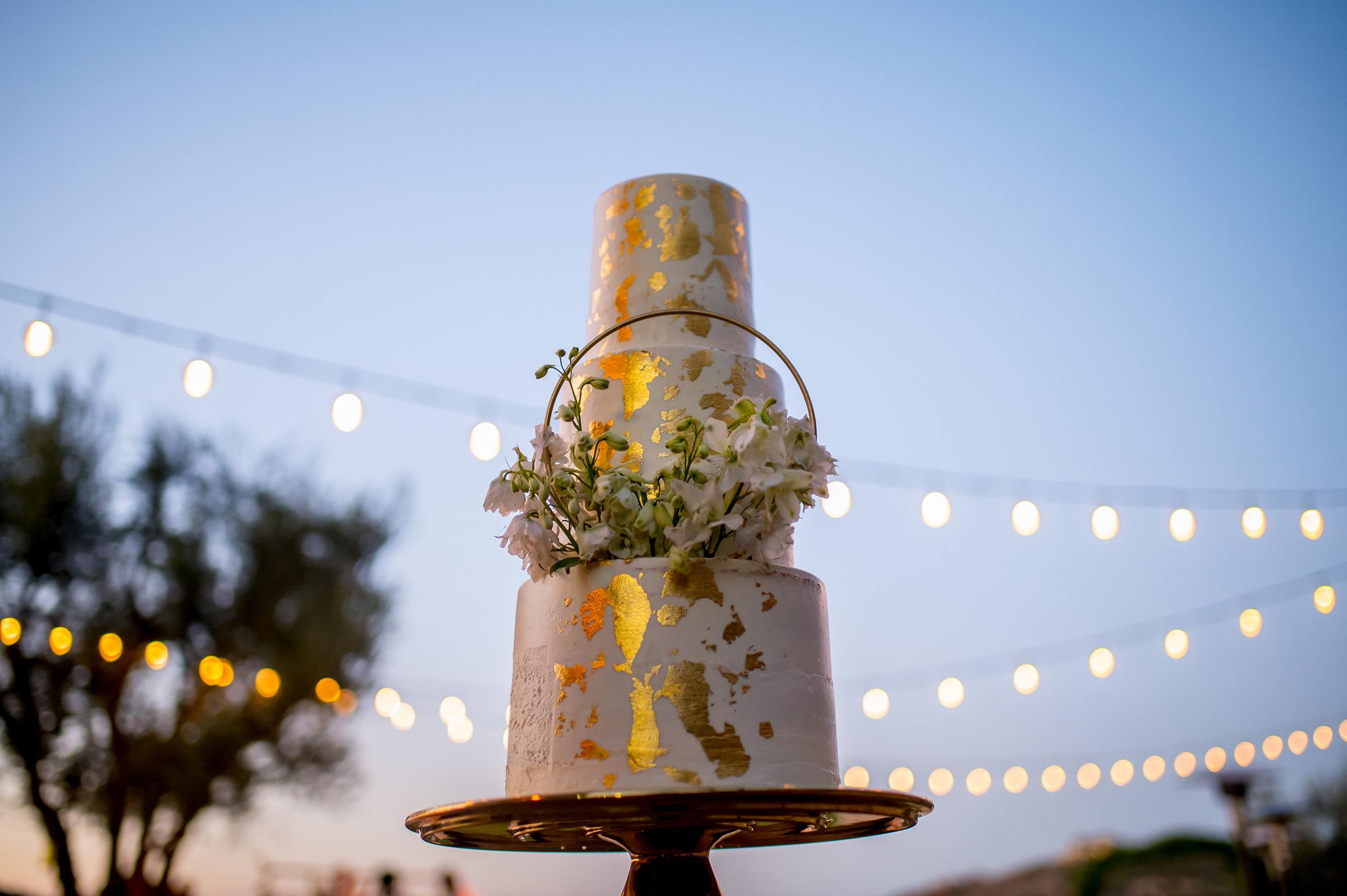 Cake with gold and floral decorations Adibe Photography