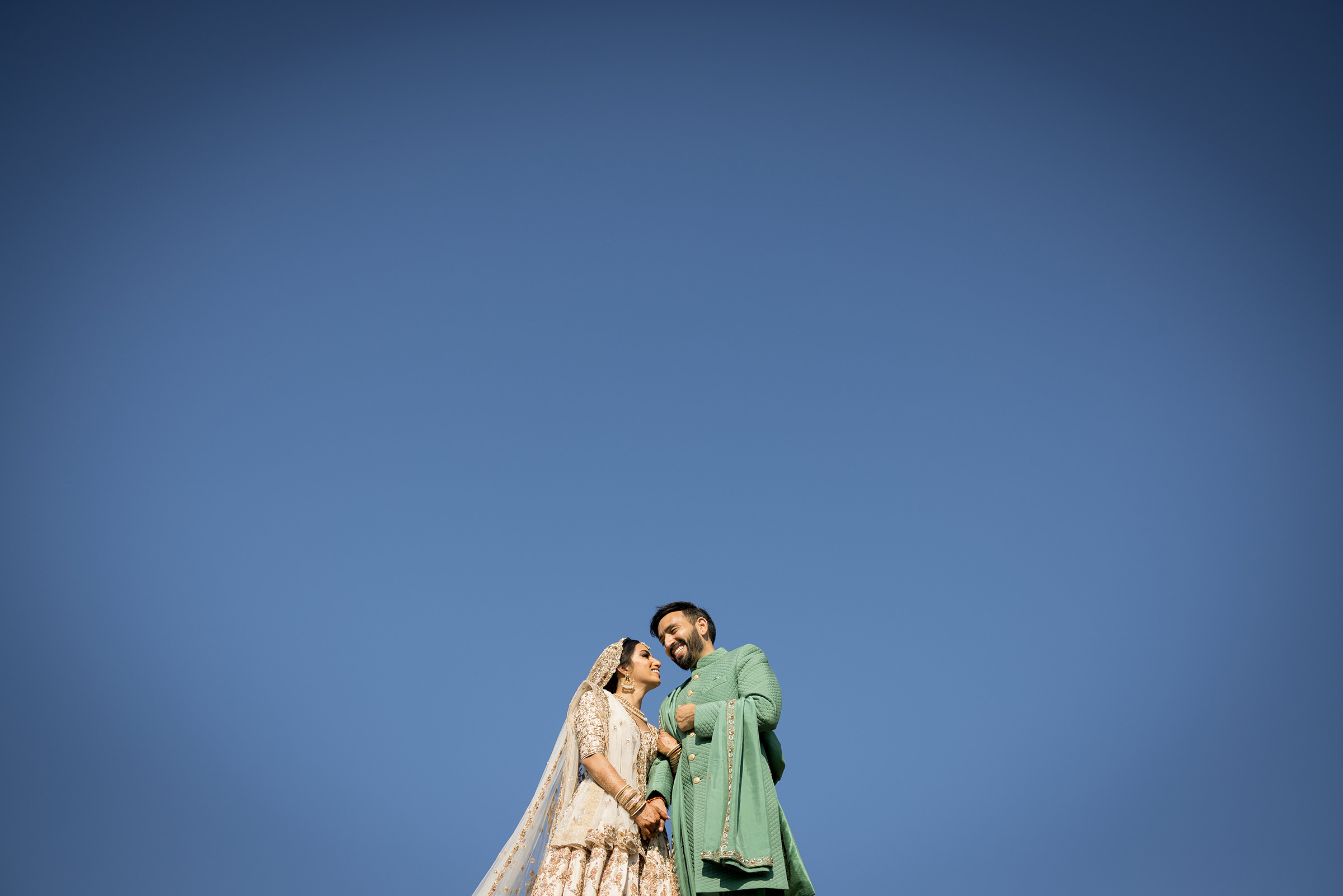 Blue sky portrait of Indian couple Akbar Sayed Photography 