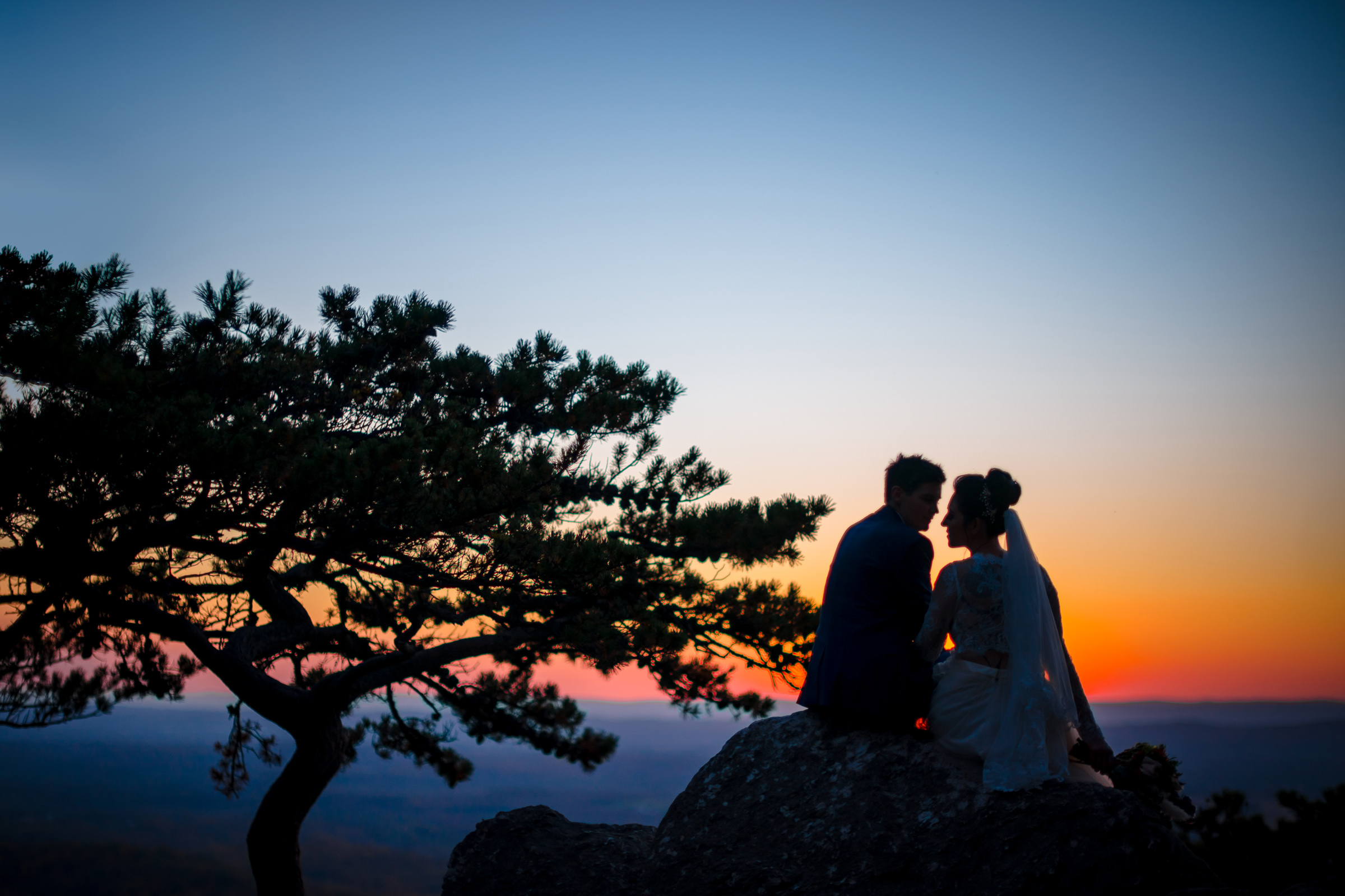 Seated silhouette elopement couple at Sugarloaf Mountain sunset Bee Two Sweet