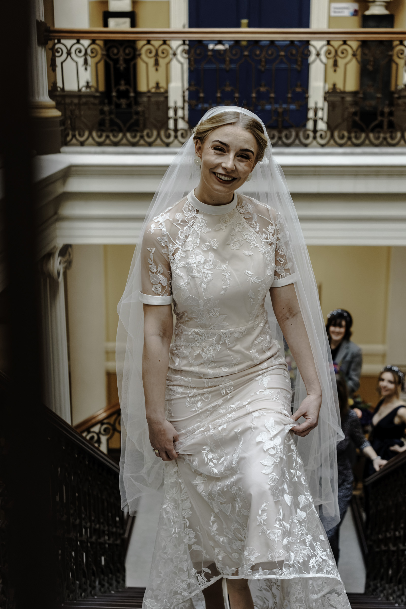 Bride ascending stairway Oliver Holder Bristol Town Hall