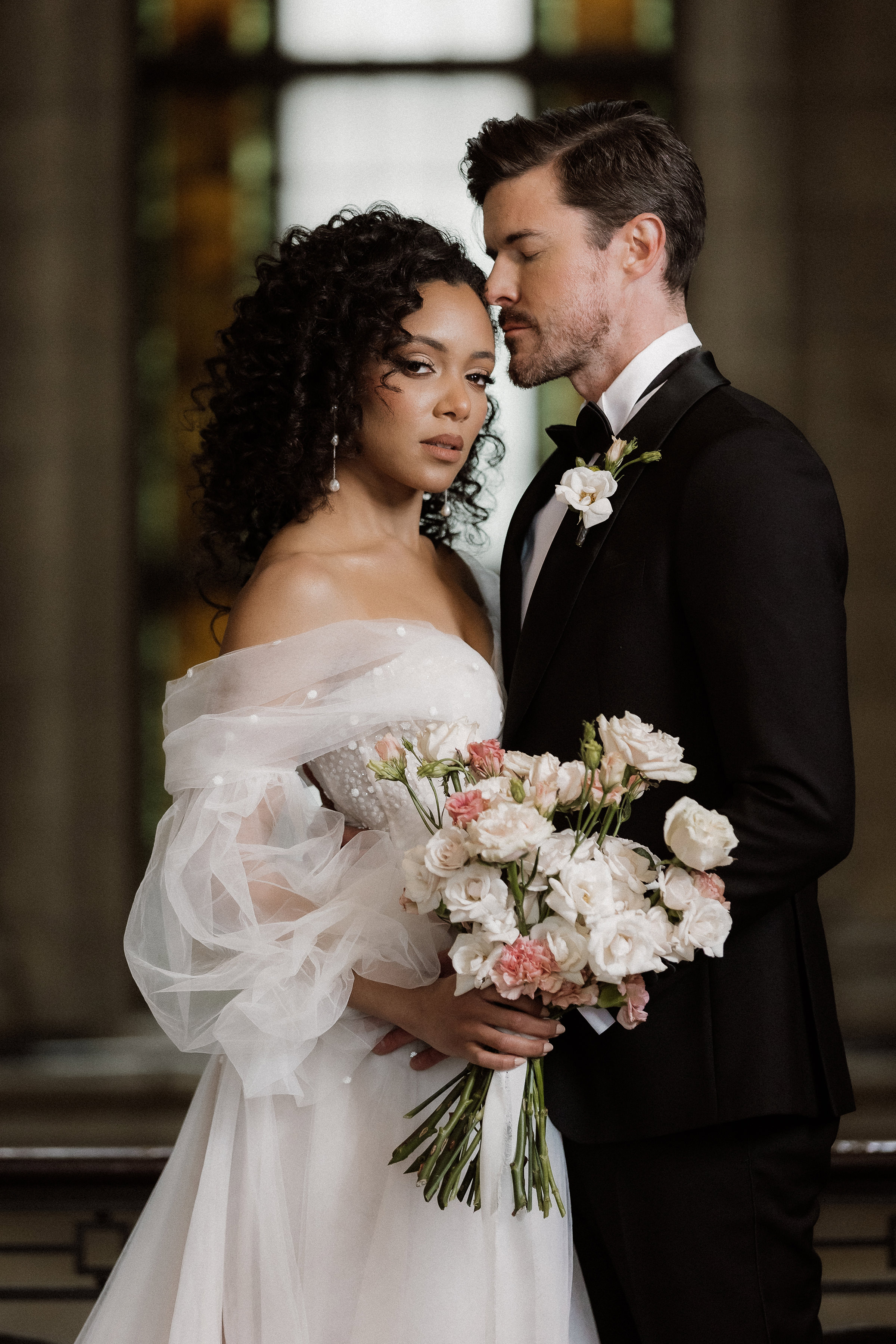 Couple portrait with pink and white rose bouquet