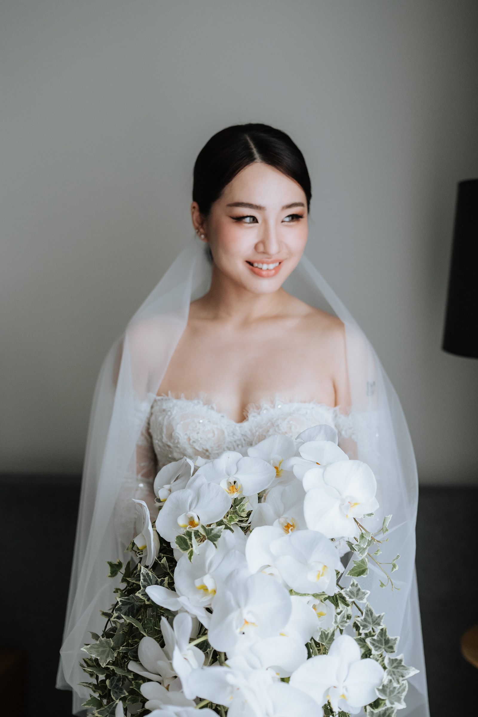 Bride portrait with orchid bouquet
