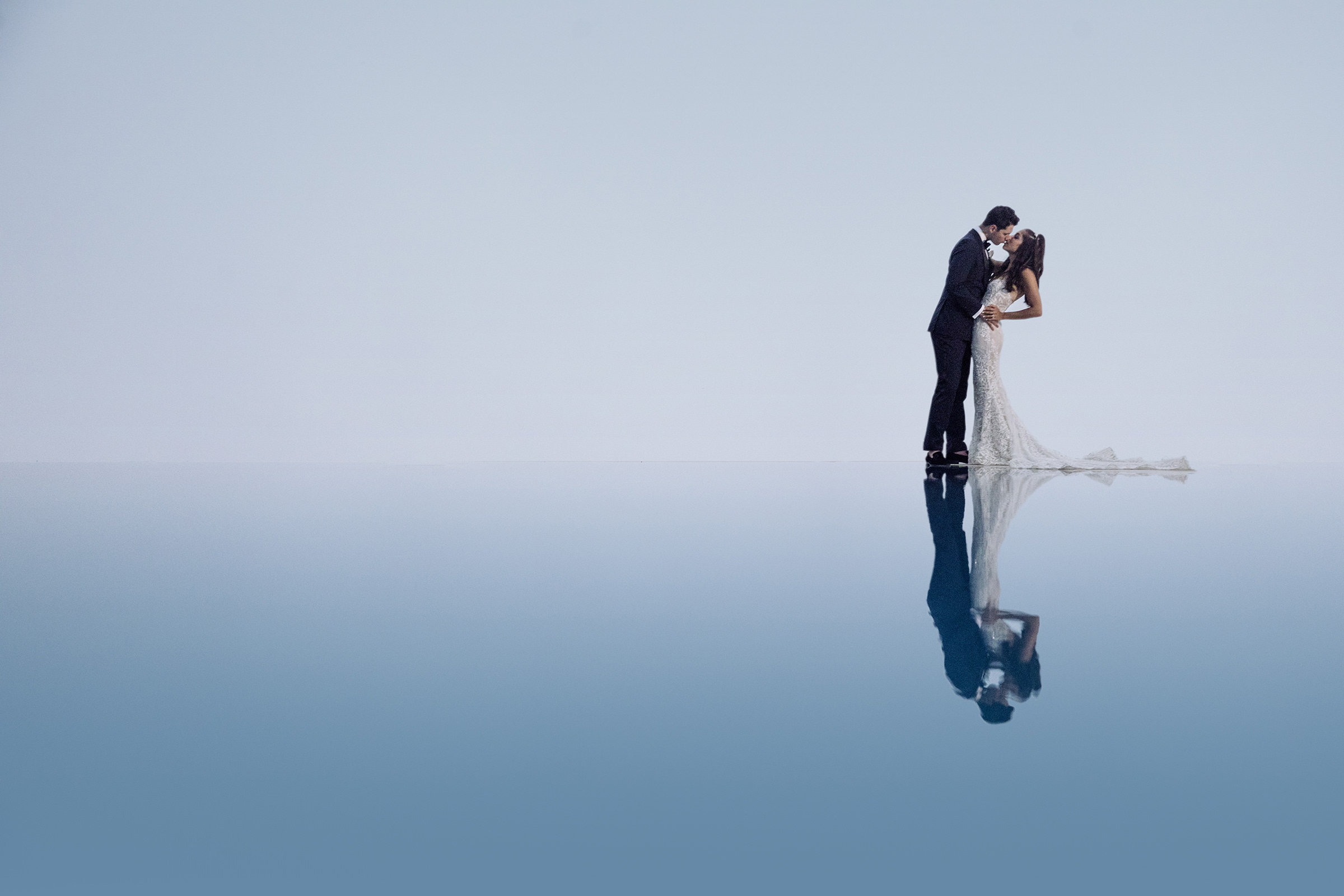 couple-kiss-reflection-in-water-photo-by-joanne-dunn-photographers