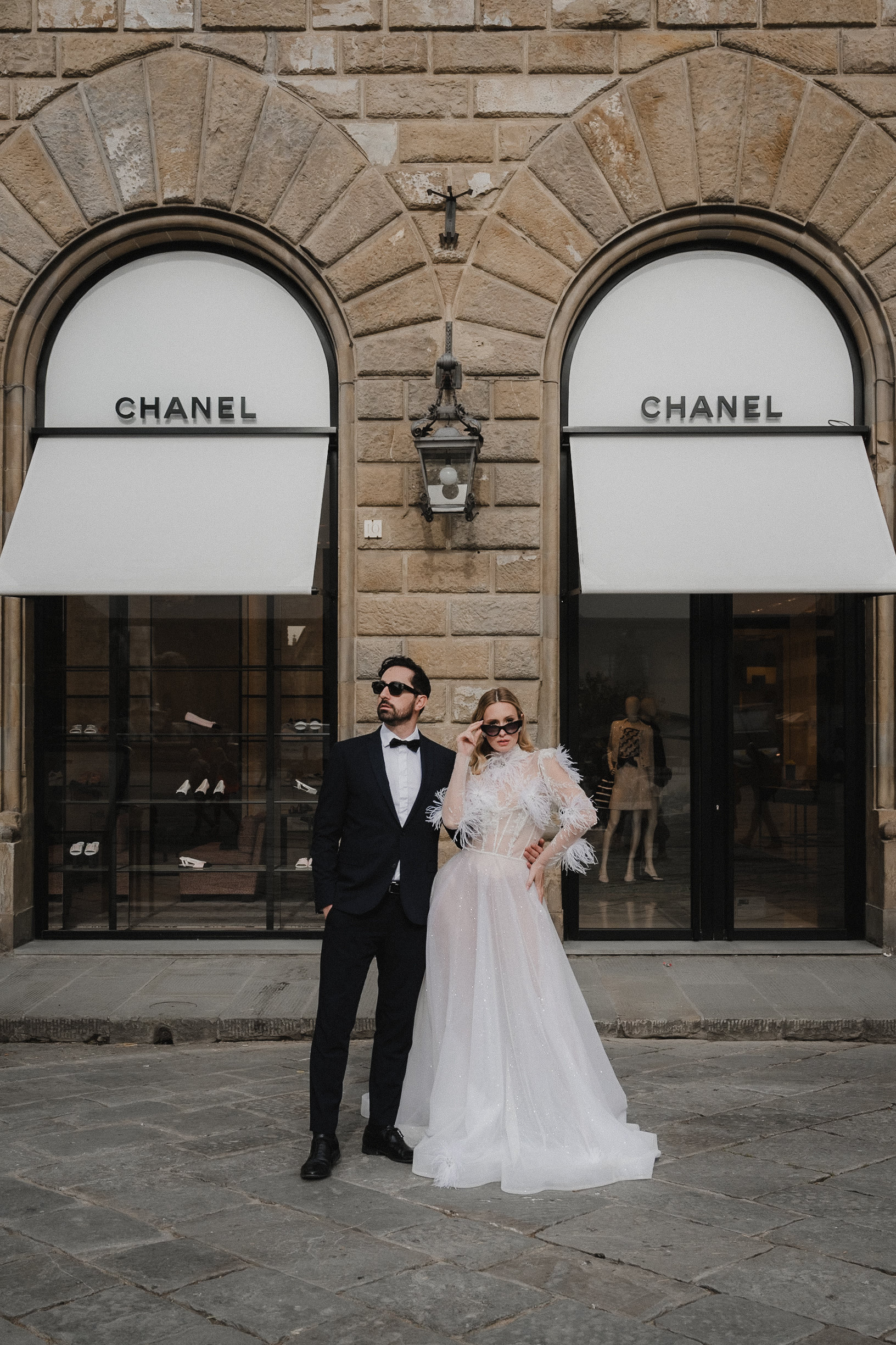 Fashion couple outside fashion boutique