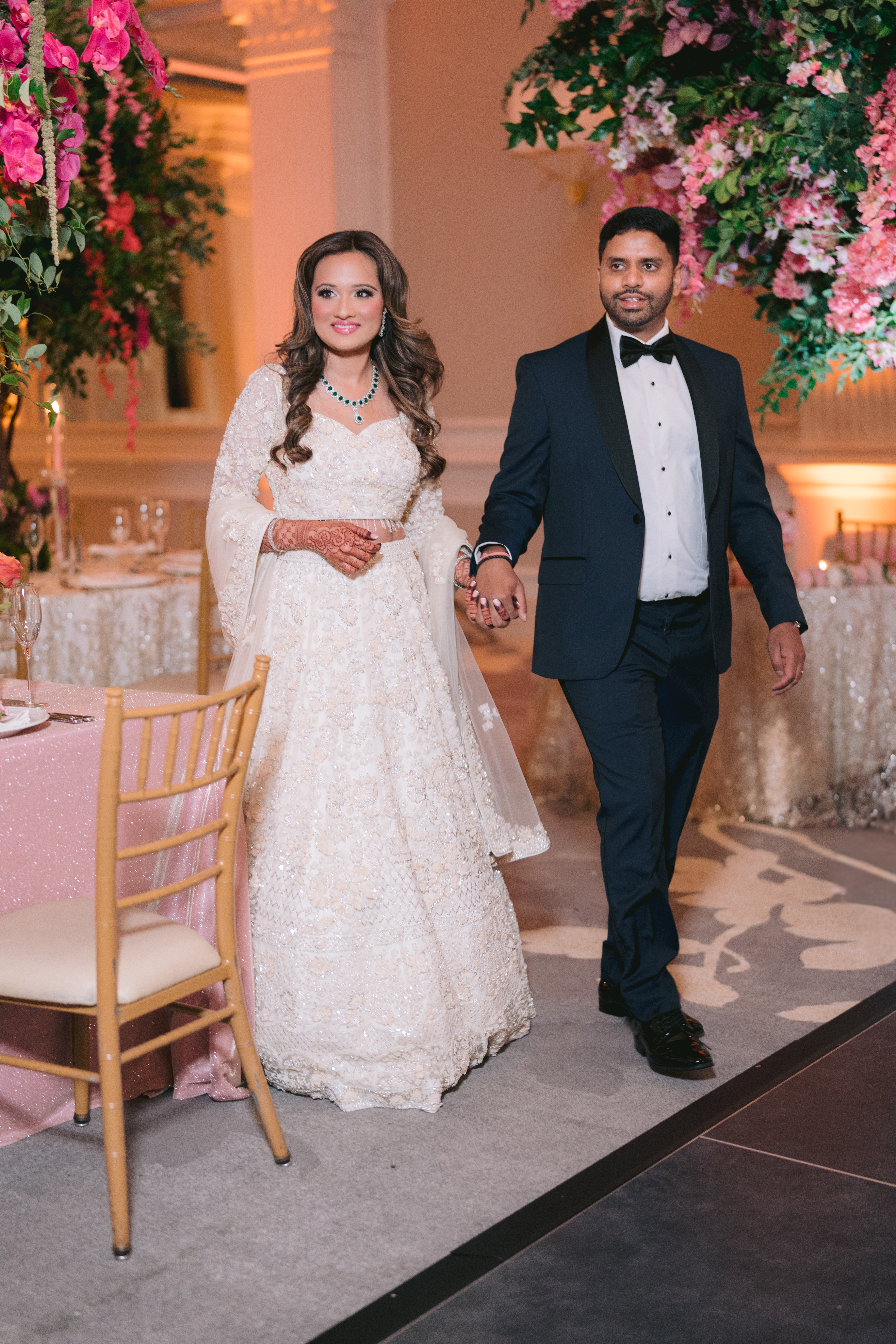 Couple entering reception City Hotel wedding, photographed by PTarfiq Photography, NY