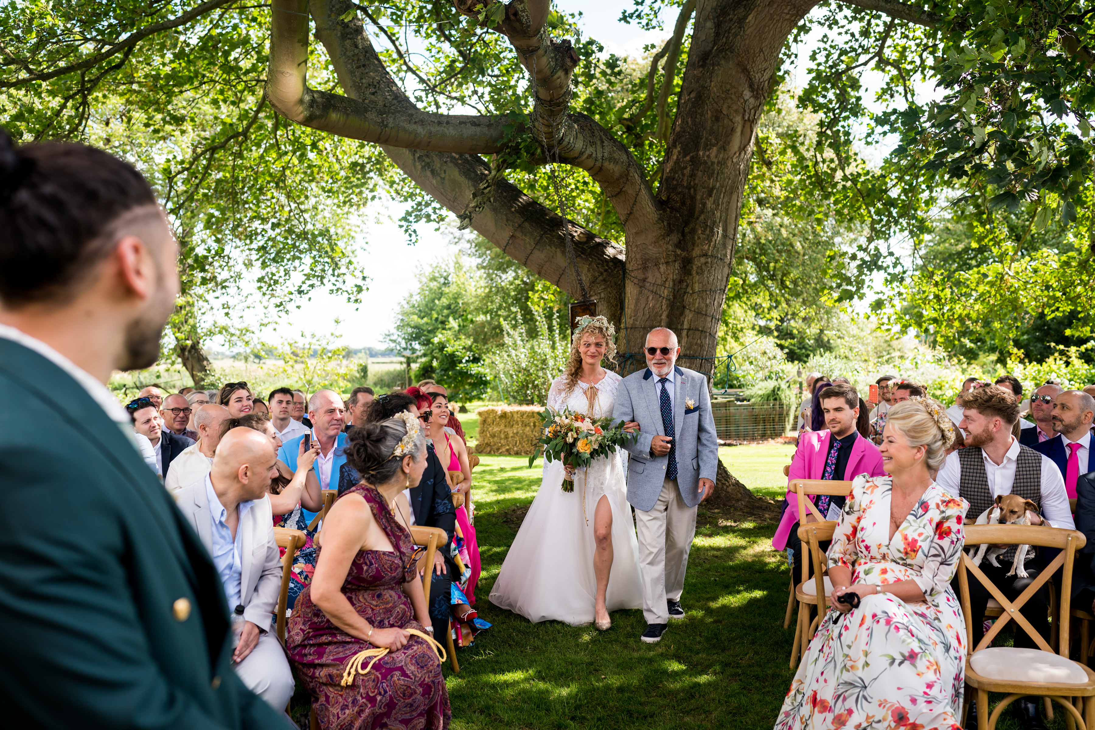 Bride walks with her Dad down the aisle to her groom