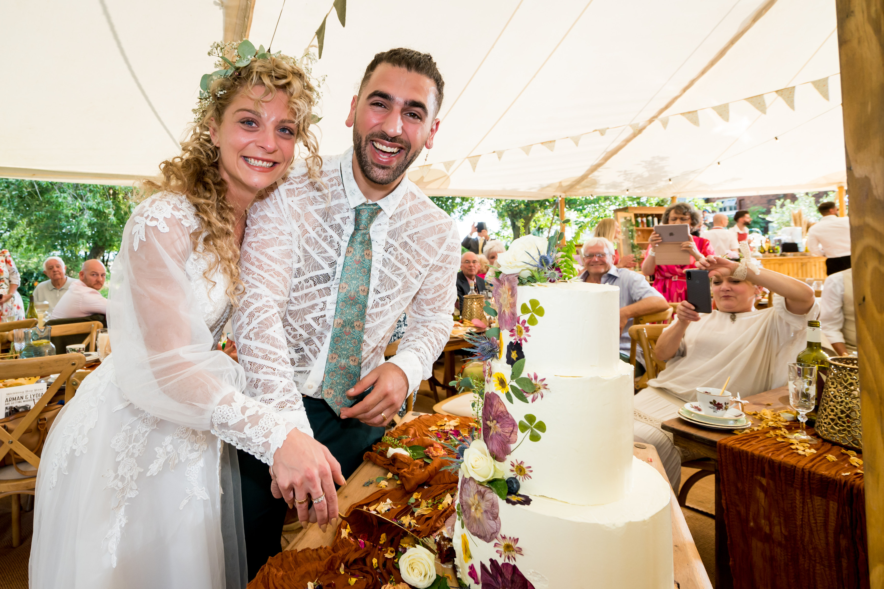 Bride and groom cutting their cake