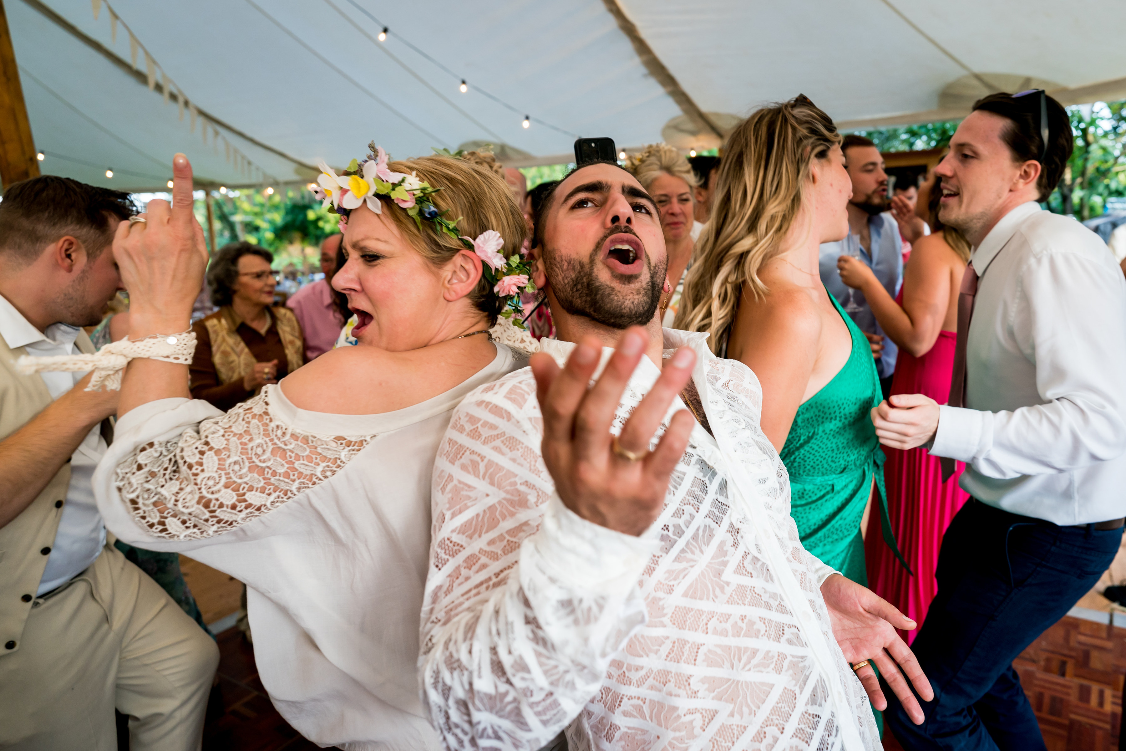 Bride and groom having fun dancing