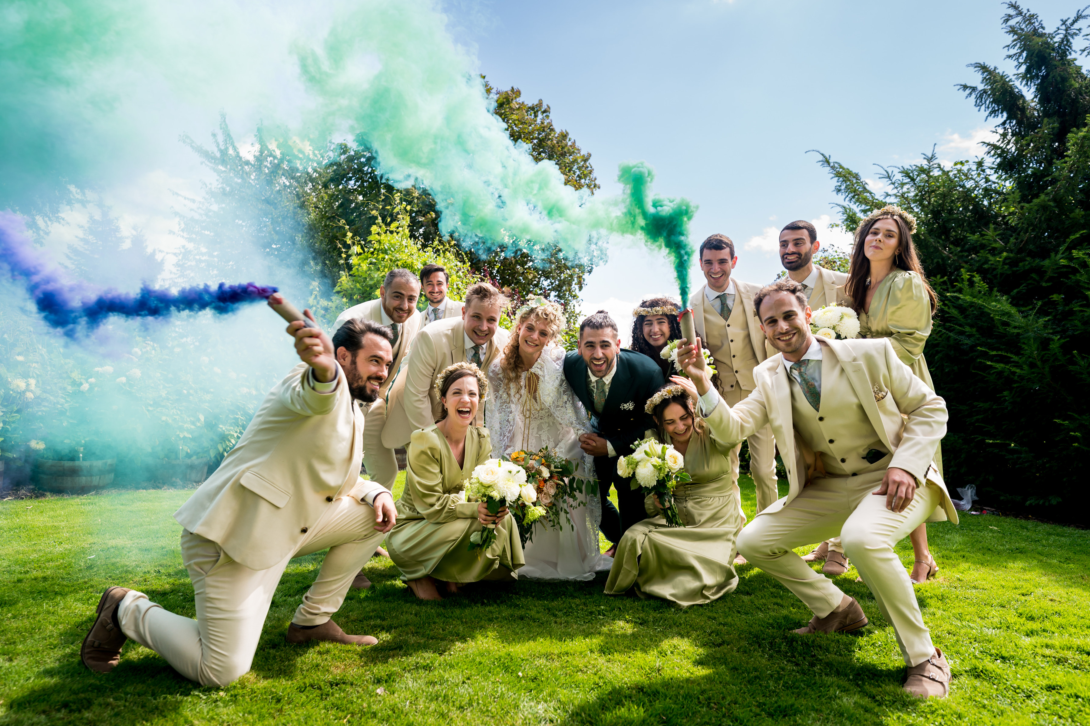 Bridal party portrait with smoky colorful flares