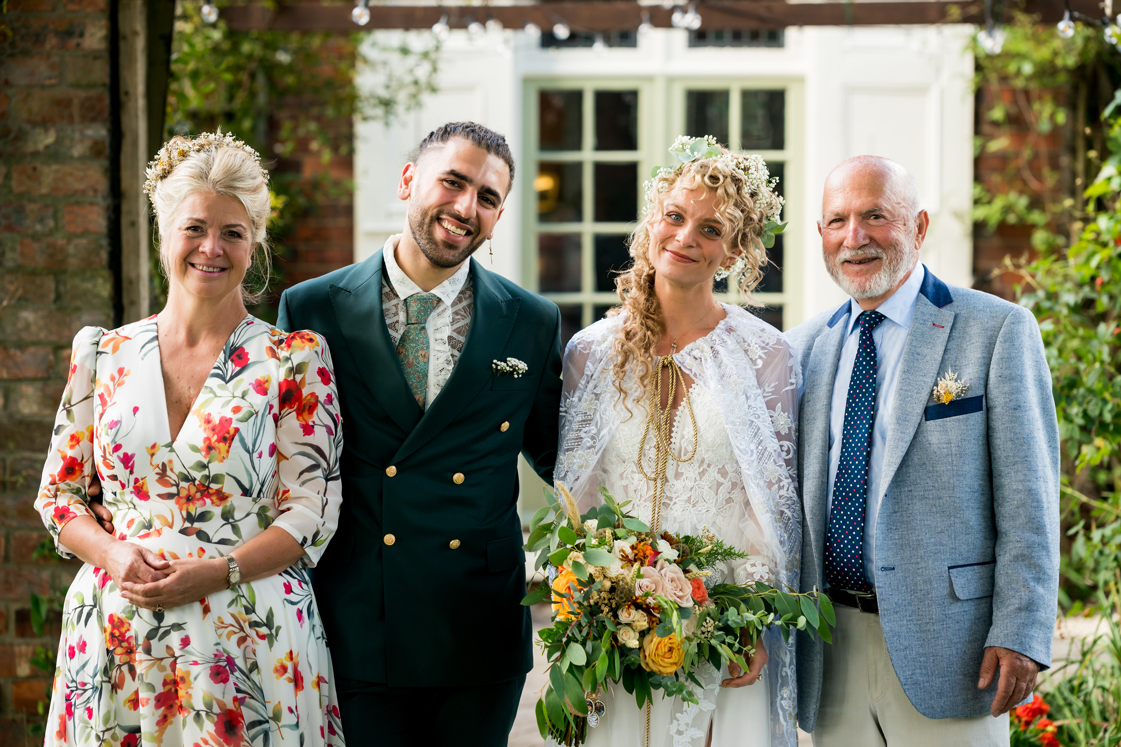 Family portrait of bride, groom, and parents