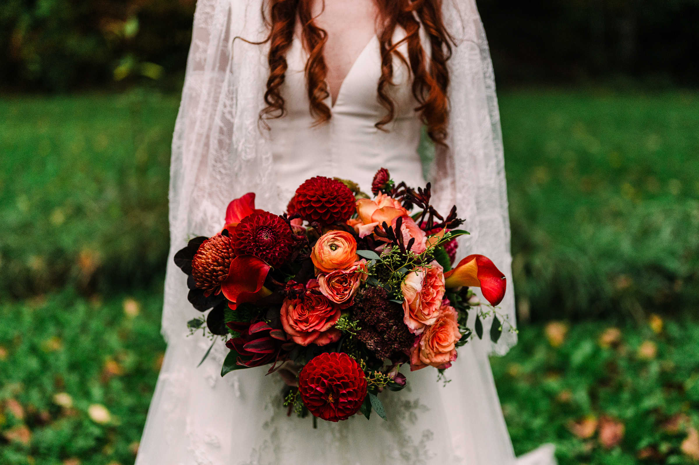 fall colored dahlias, calla lilies, and ranunculus