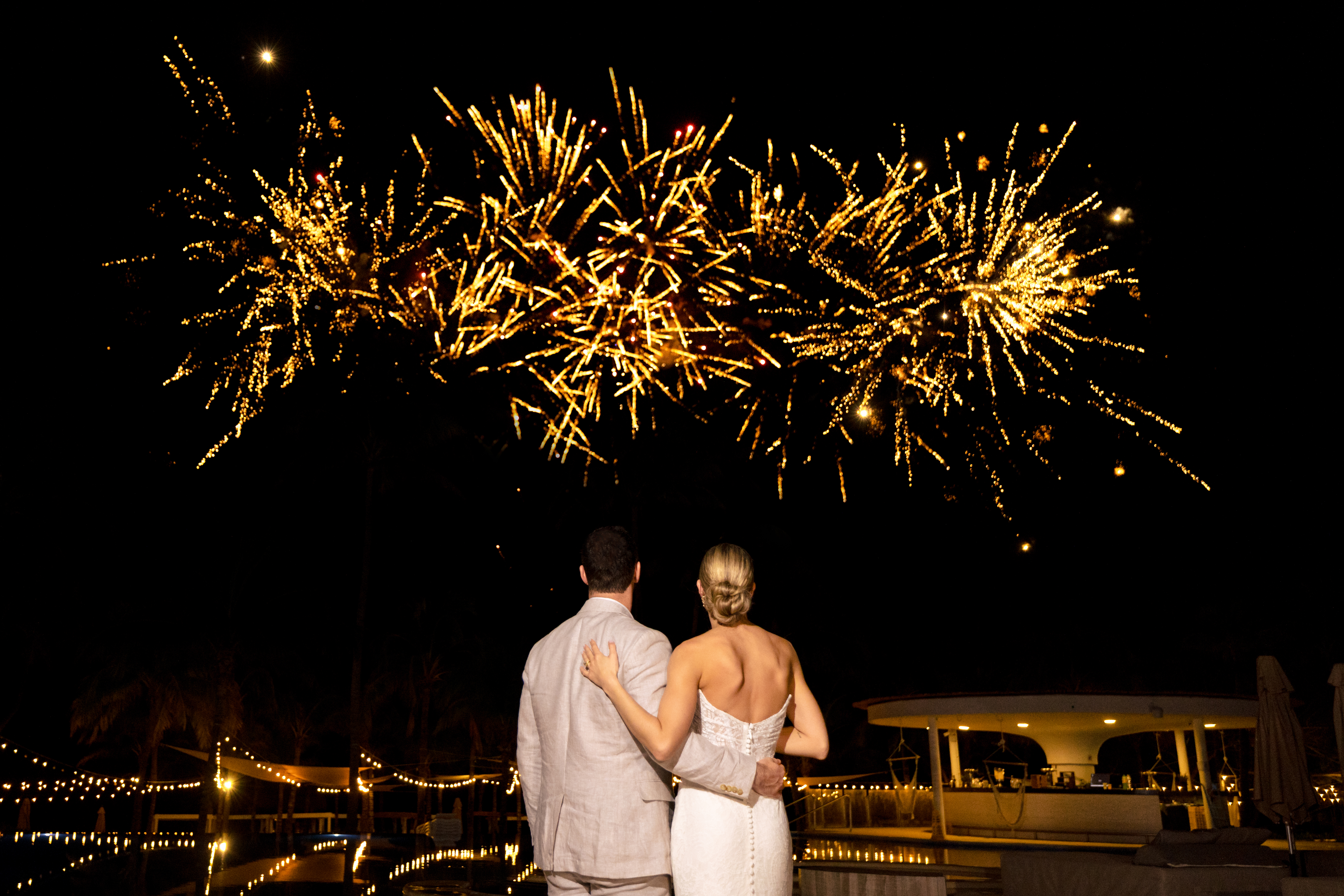 couple watching fireworks together-The Fives Beach Hotel Wedding by M.E.Photo & Films