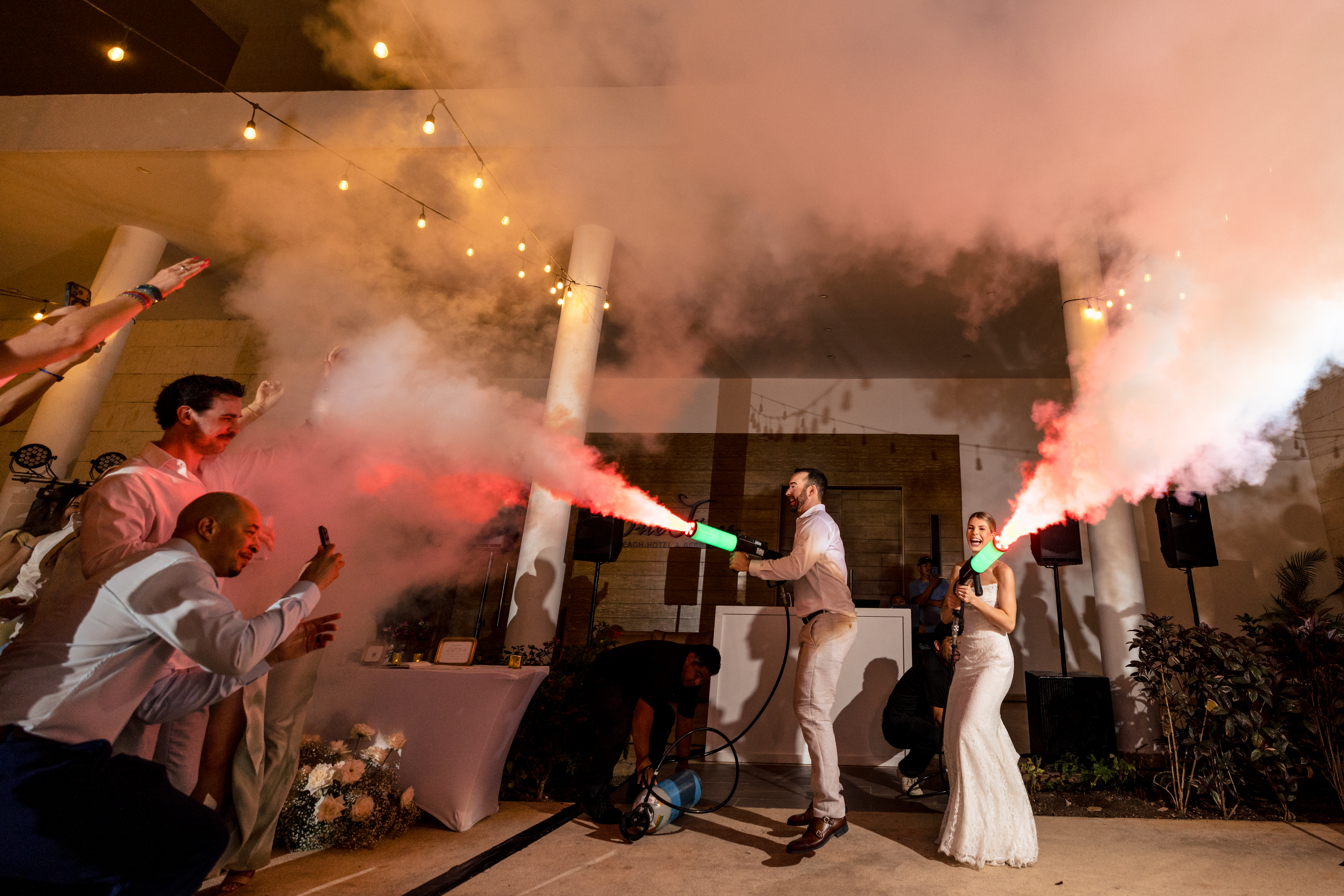 couple spraying colorful foam on dance floor-M.E. Photo & Films