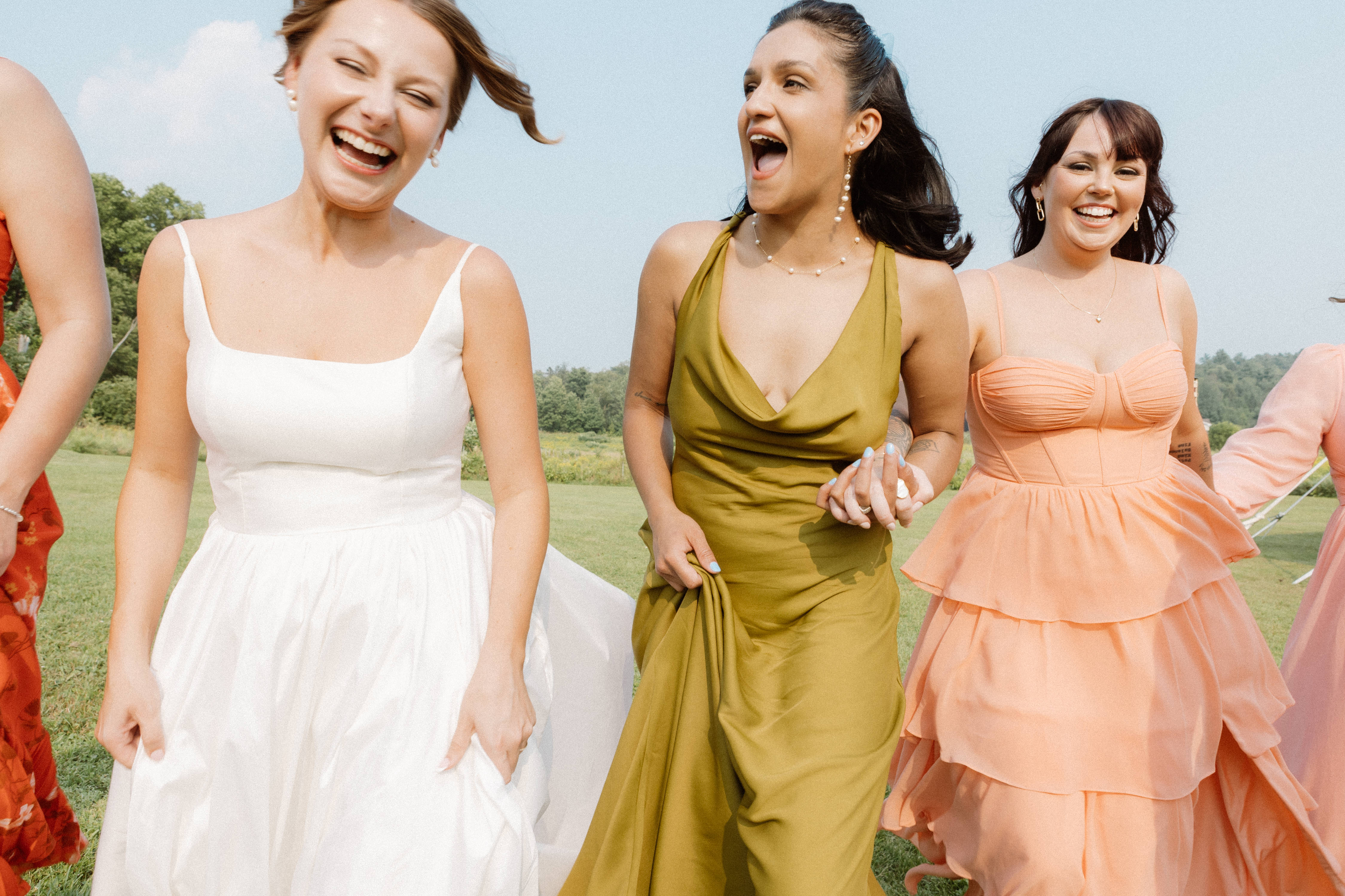 bride and bridal party laughs-Myriam Menard Photographe