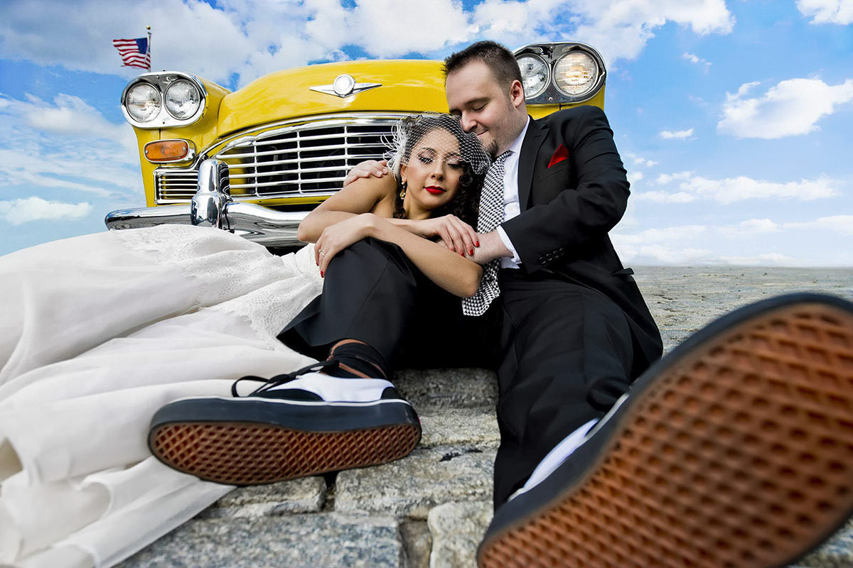 bride-and-groom-portrait-on-the-cobblestones-with-their-yellow-antique-car-photo-by-matthew-sowa-photography