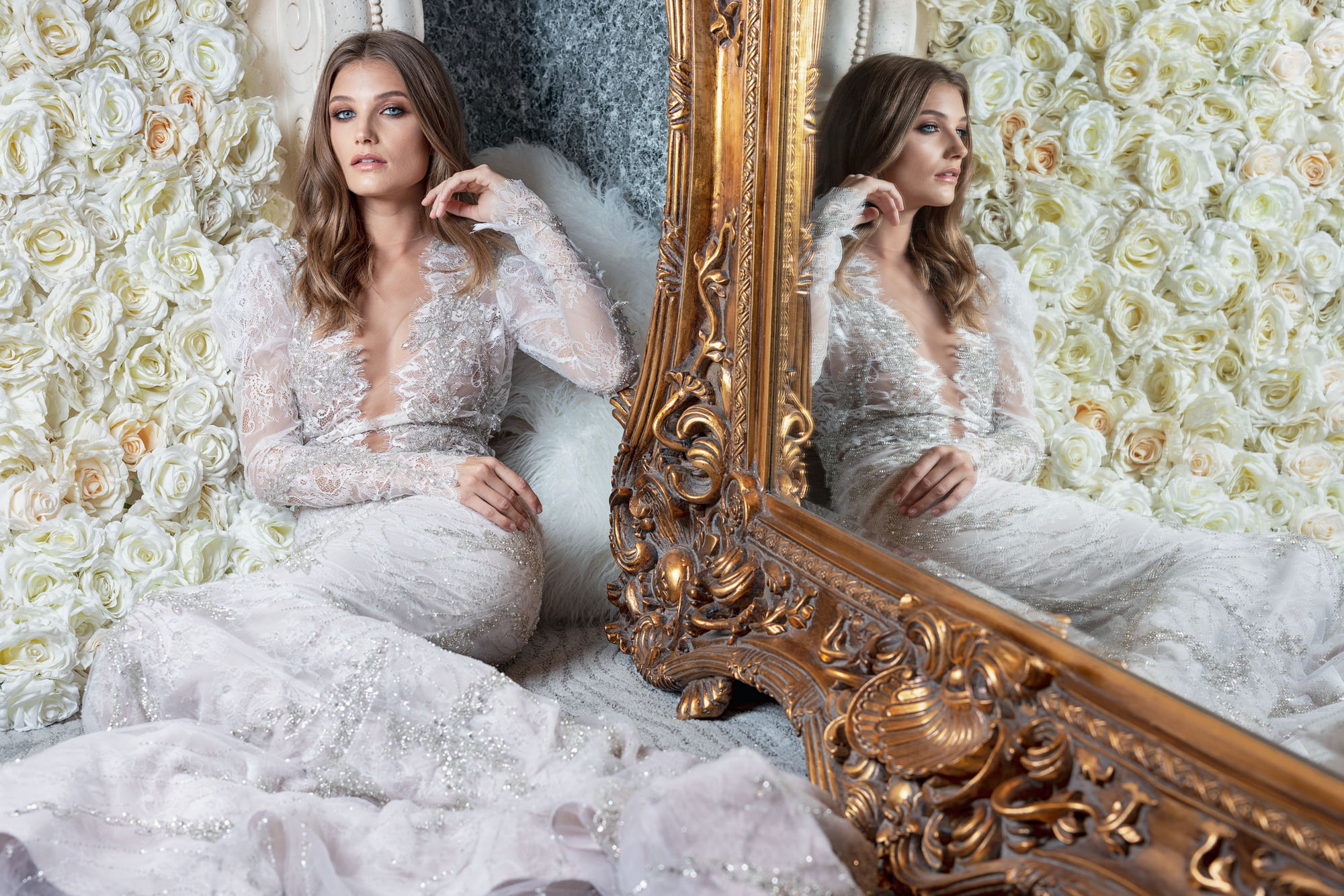 Bride in silver beaded lace couture gown in mirror by Roberto Valenzuela, Los Angeles