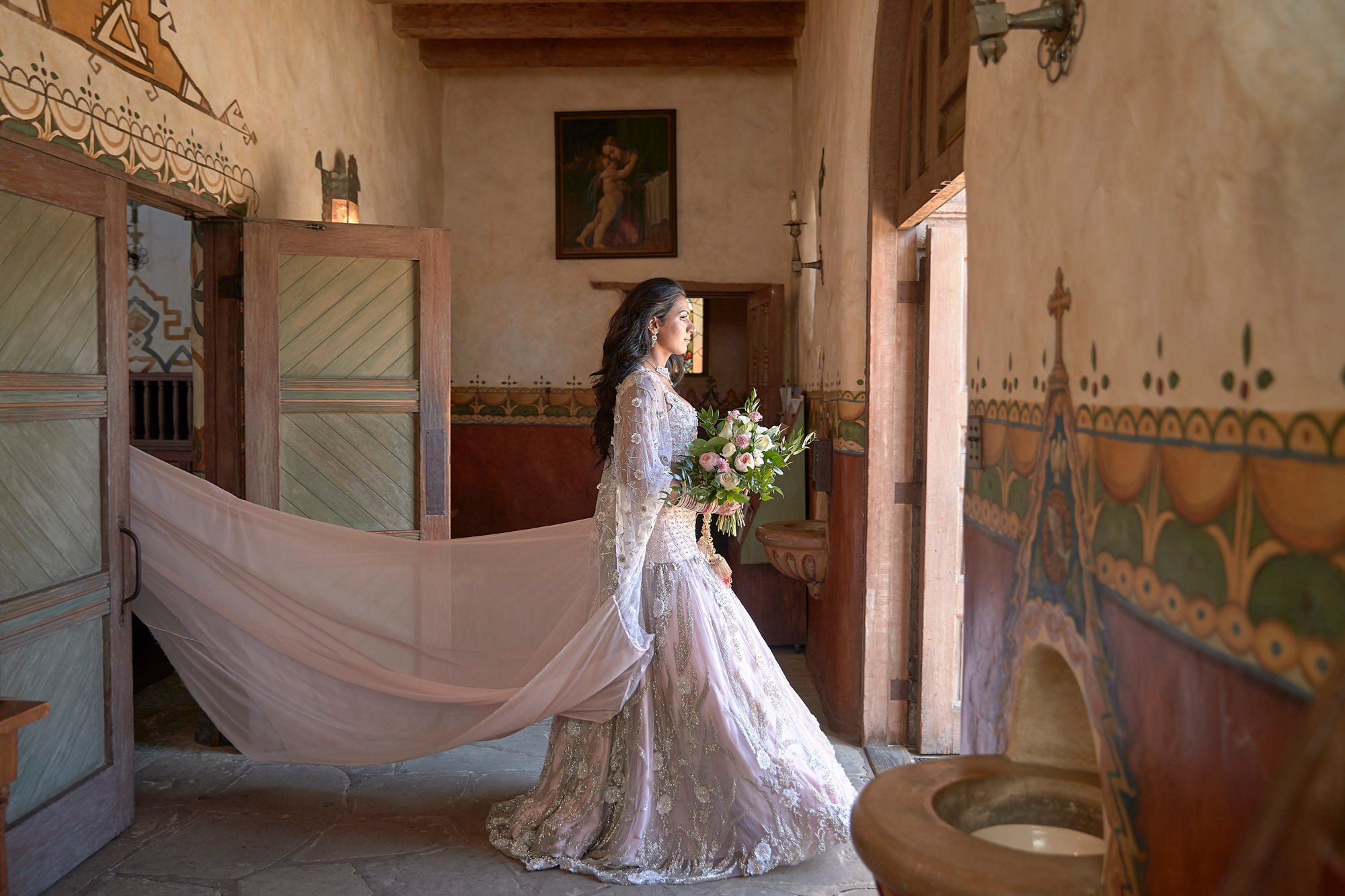 Bride in petal pink beaded wedding gown by Roberto Valenzuela, Los Angeles