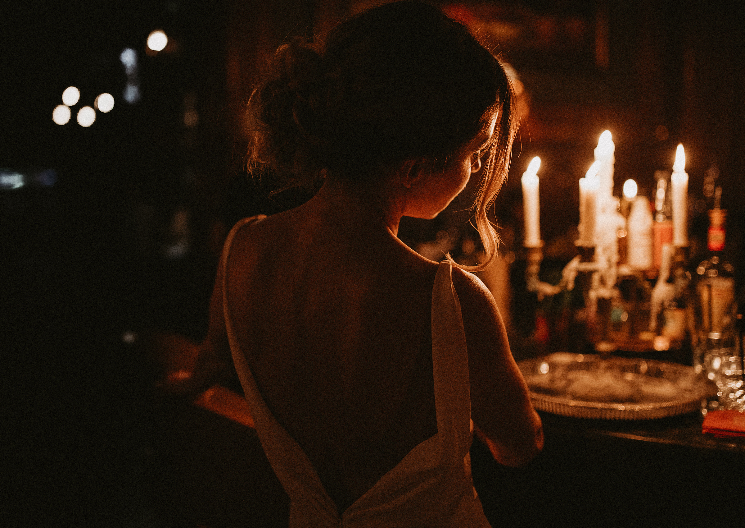 bride silhouetetted by fireplace light-Lana Nimmons Photography