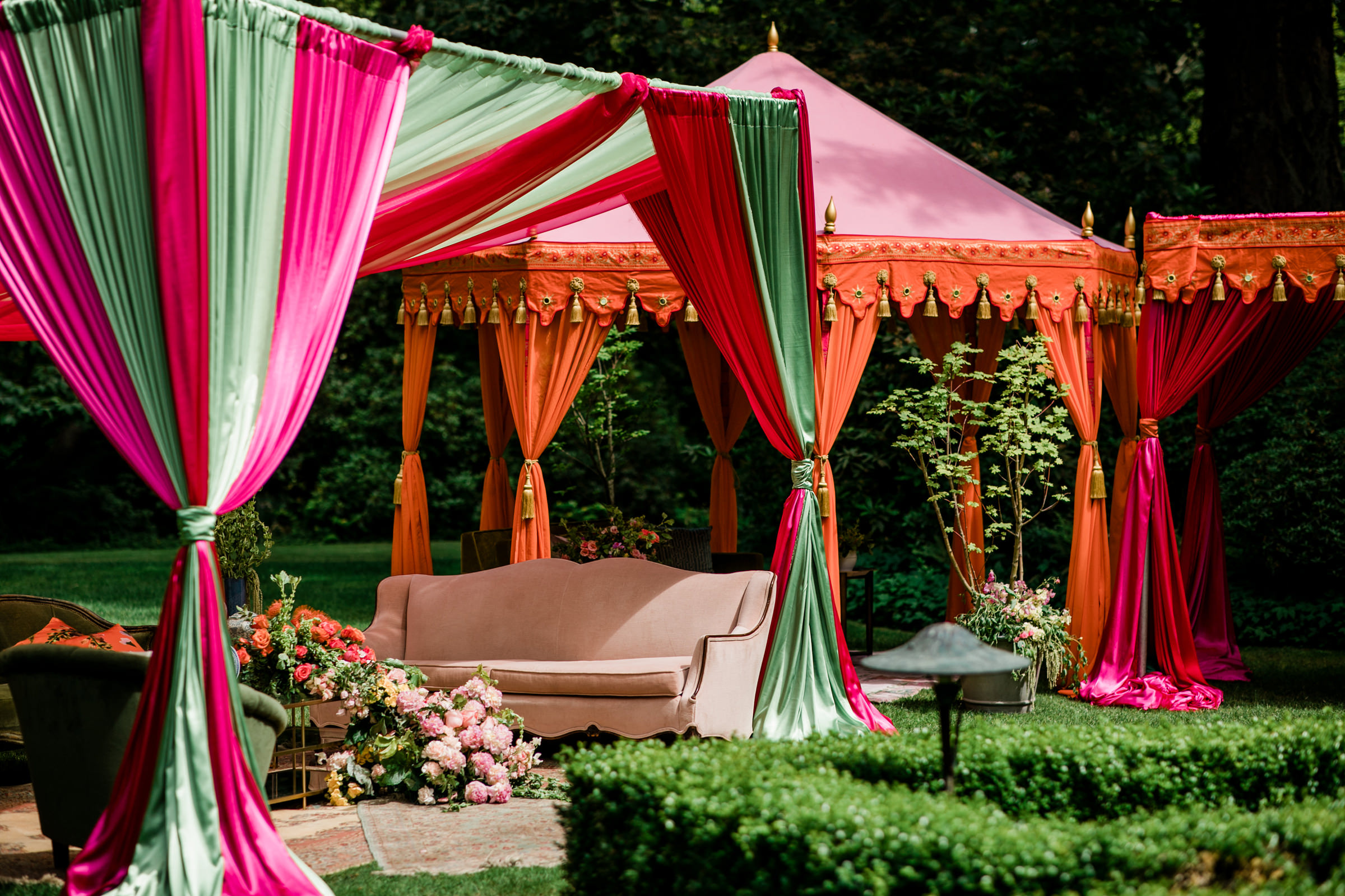 Silk wedding reception tents in red, green and orange photographed by Into Dust Photography - Seattle