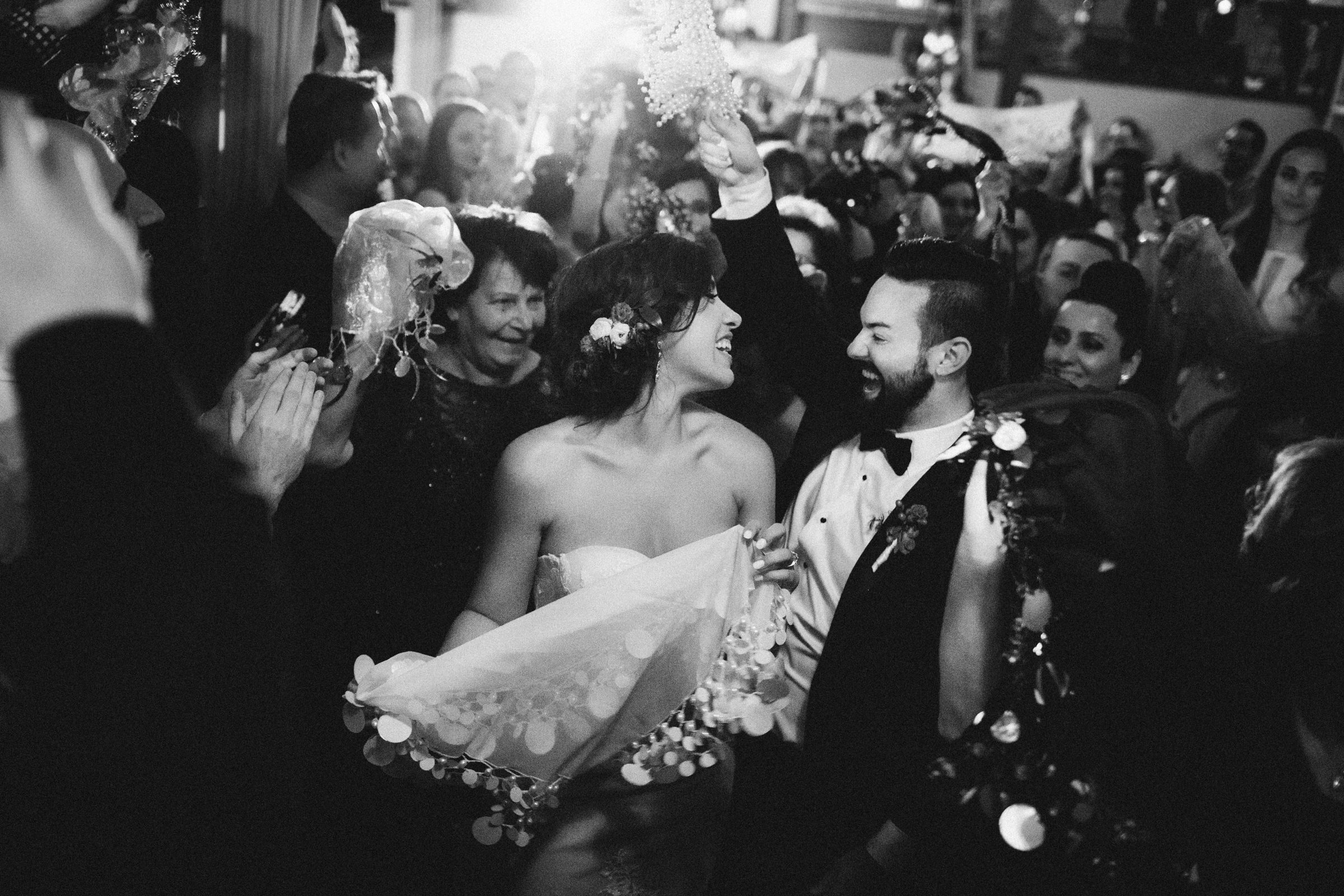 Bride and groom estatically happy on the dance floor - photographed by Caroline Ghetes - New York wedding photographer