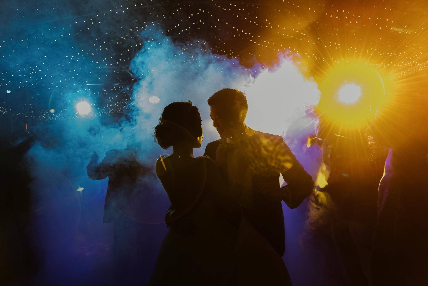 Couple amid colored smoke and lights - Maloman Studios - New York photographers