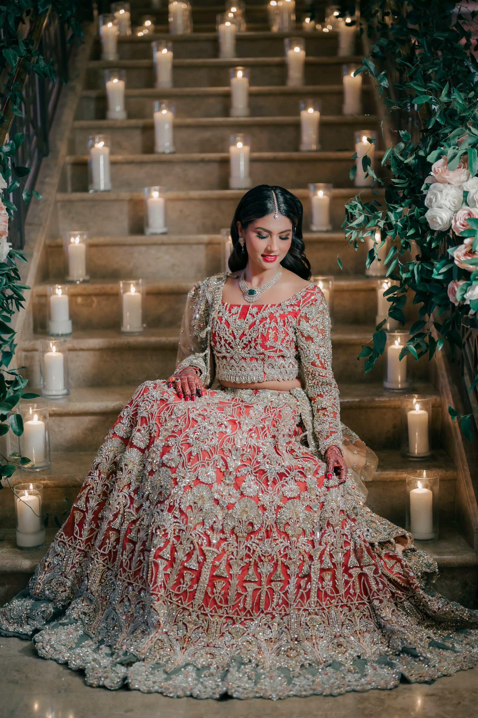 Indian bride on candlelit stairway, photographed by MNM Photography, Houston wedding photographers