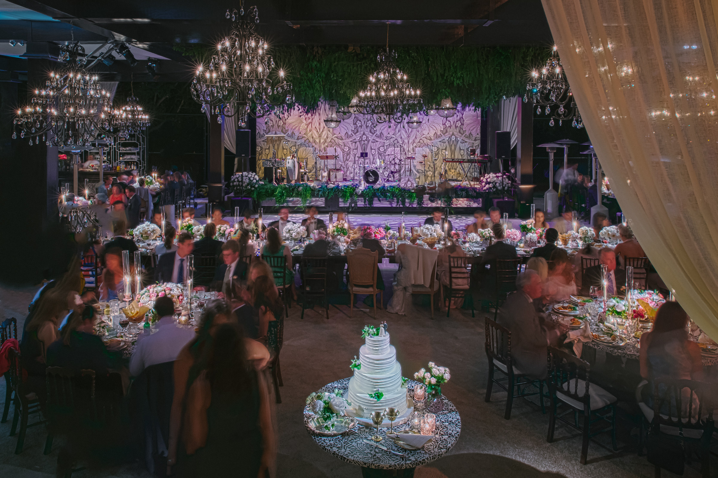 Reception dinner with chandeliers and cake by Amy and Stuart of Los Angeles