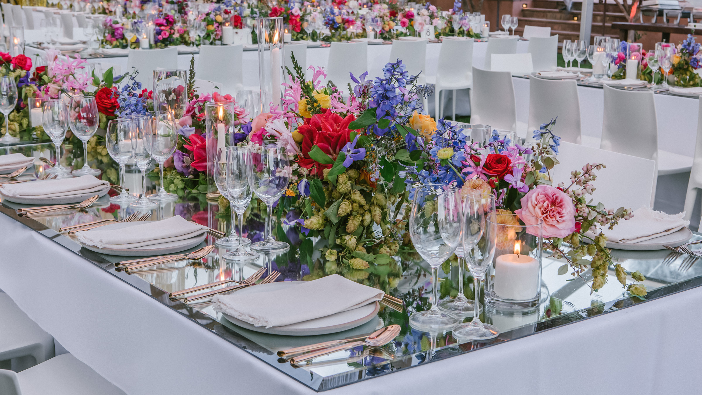 Red rose and blue delphinium centerpieces photographed by Amy and Stuart - Los Angeles