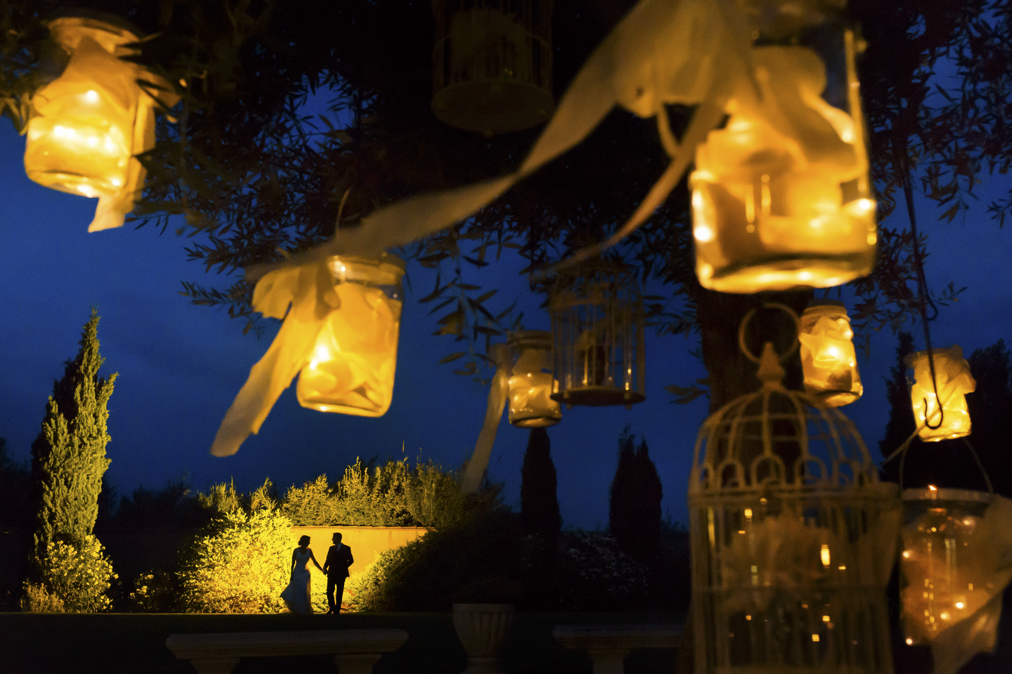 Silhouette of couple and golden lanterns by Look Fotografia of Los Angeles