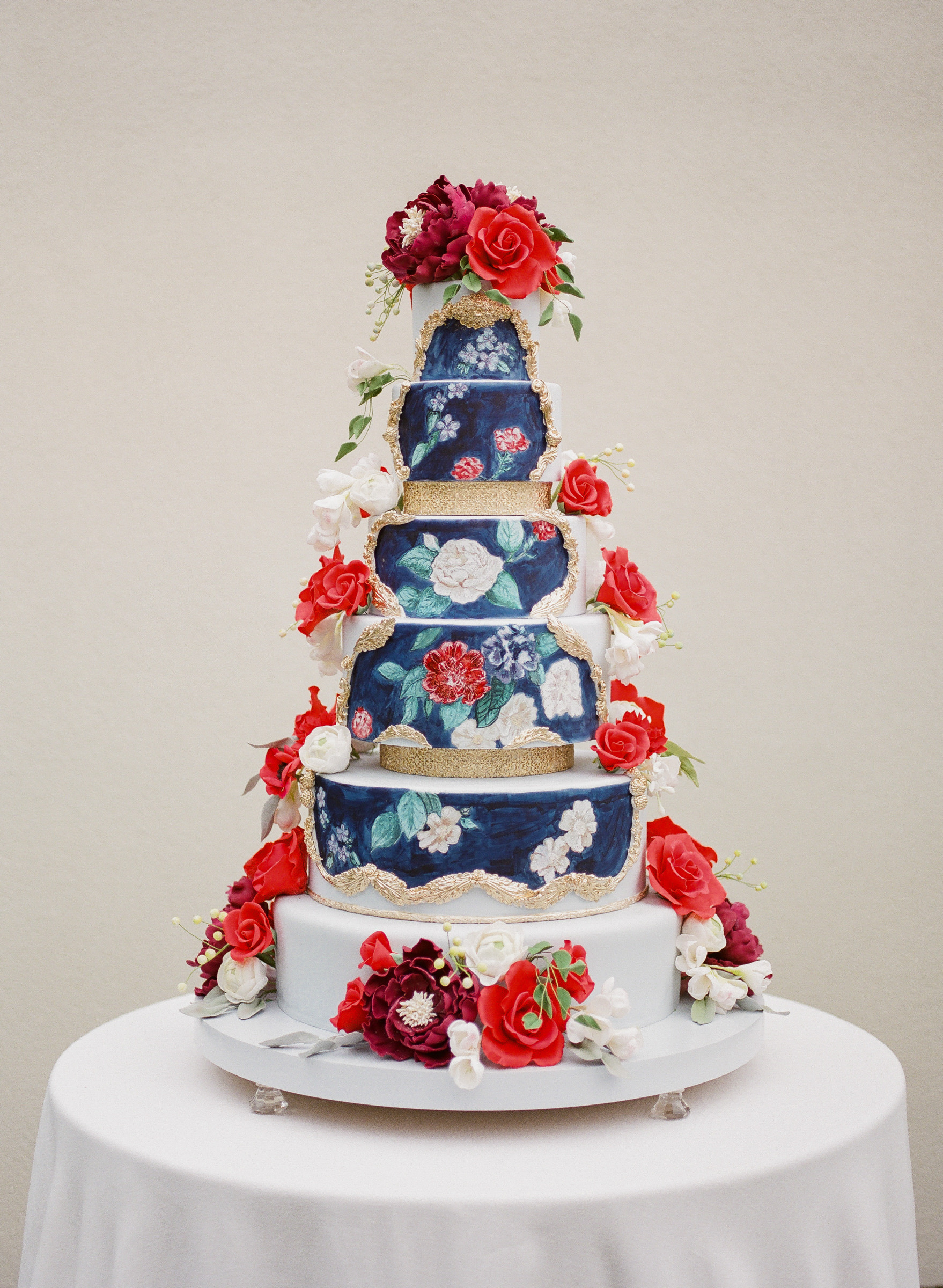 Six tiered floral painted wedding cake photographed by Corbin Gurkin - South Carolina