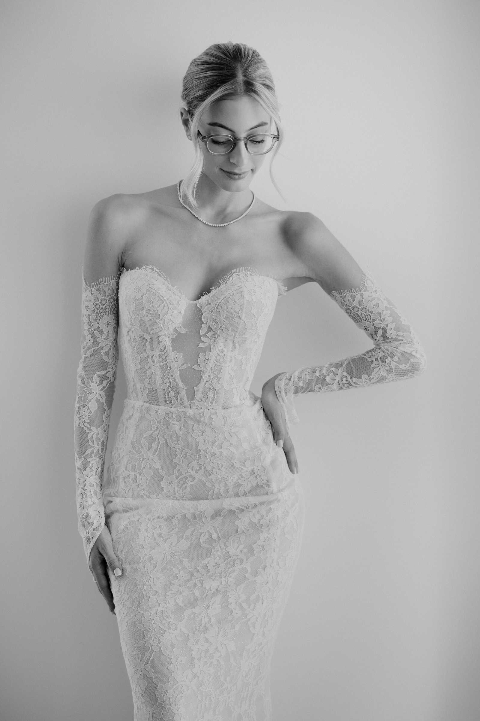 Bride in strapless wedding dress with lace sleeves, photographed by Eran Berri, Israel wedding photographers