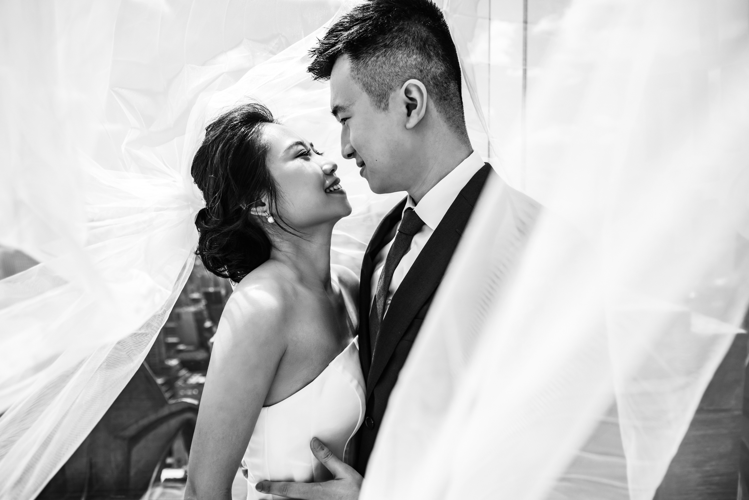 sweet-face-to-face-couple-portrait-inside-billowing-veil-yun-li-photography