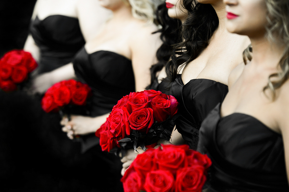 vibrant-red-bouquets-held-by-bridesmaids-in-black-strapless-dresses-photo-by-matthew-sowa-photography