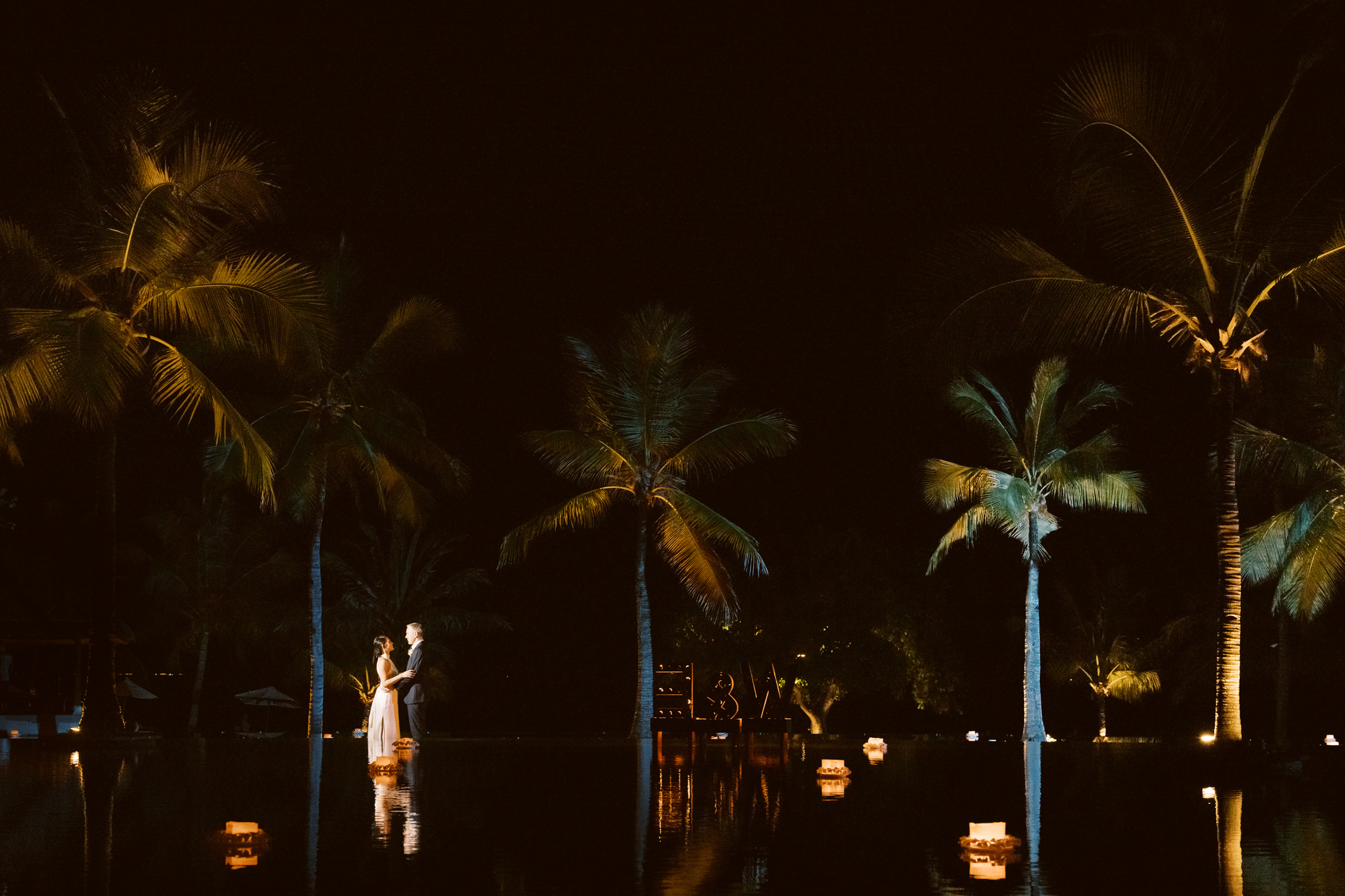 Pool area first dance, wedding at The Oberoi Resort, Lombak