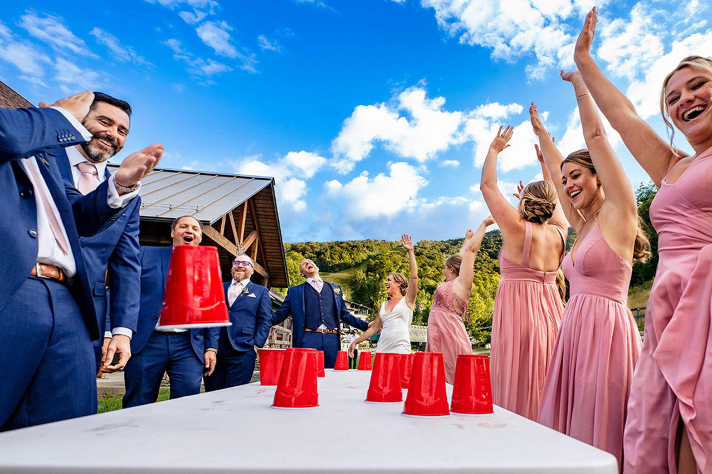 Award winner, wedding party playing beer pong - photo by Vermont wedding photographer Andy Madea Photo
